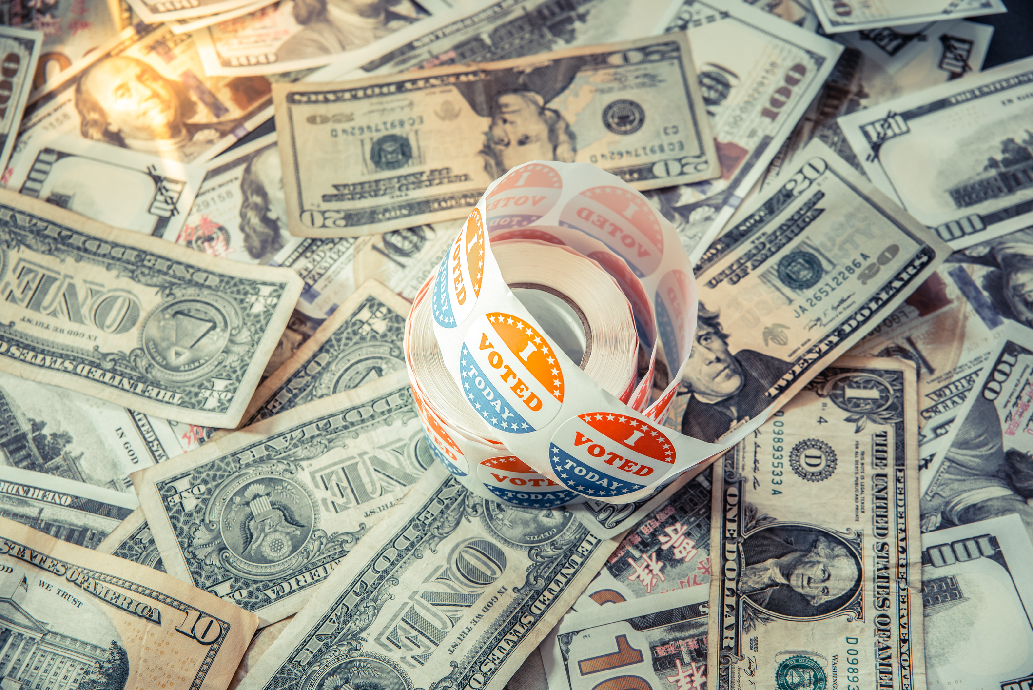 'I voted' stickers on top of money