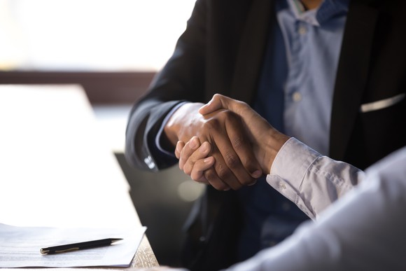 Two businessmen shaking hands.