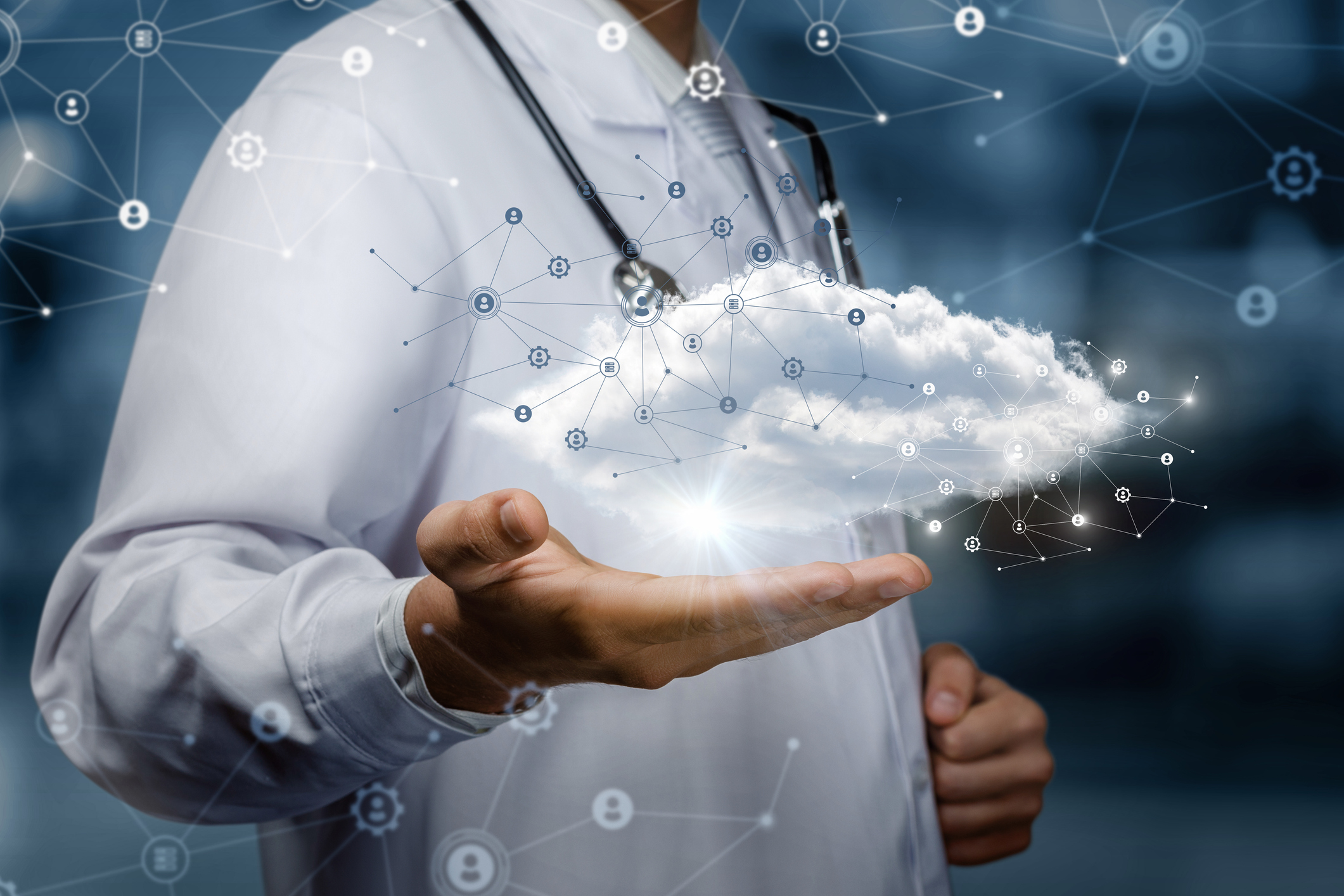 A doctor holds a cloud which represents data.