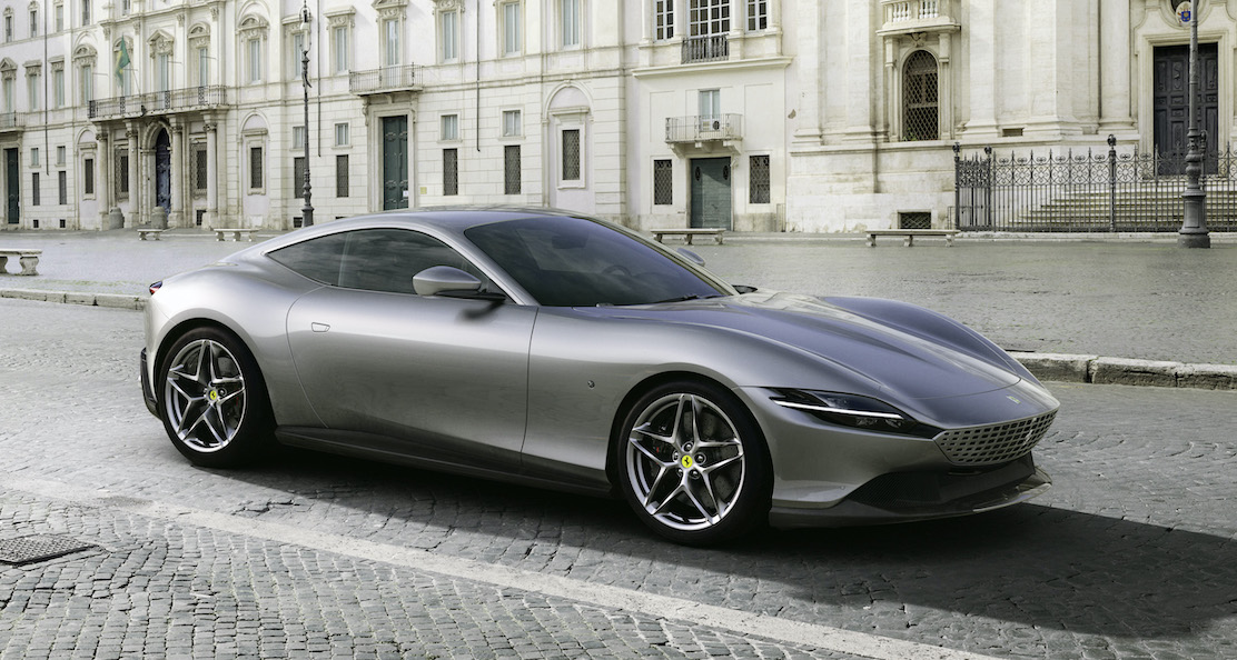 A silver Ferrari Roma, a sleek front-engined sports coupe. 