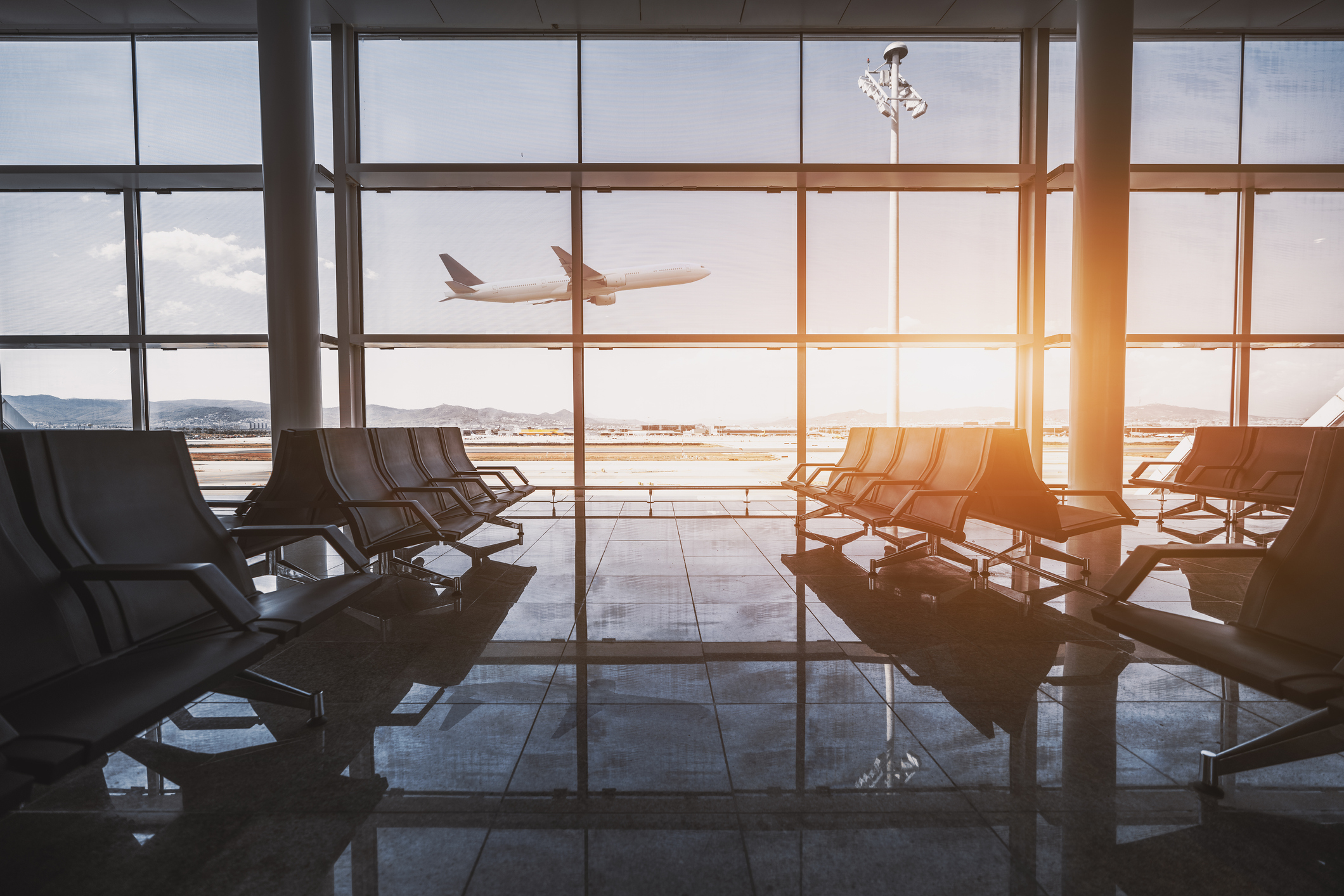 View through the window from an empty airport lounge.