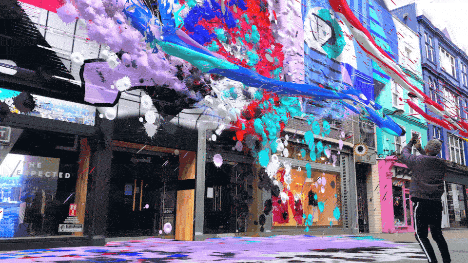 Snapchat being used to make a mural on a real world wall.