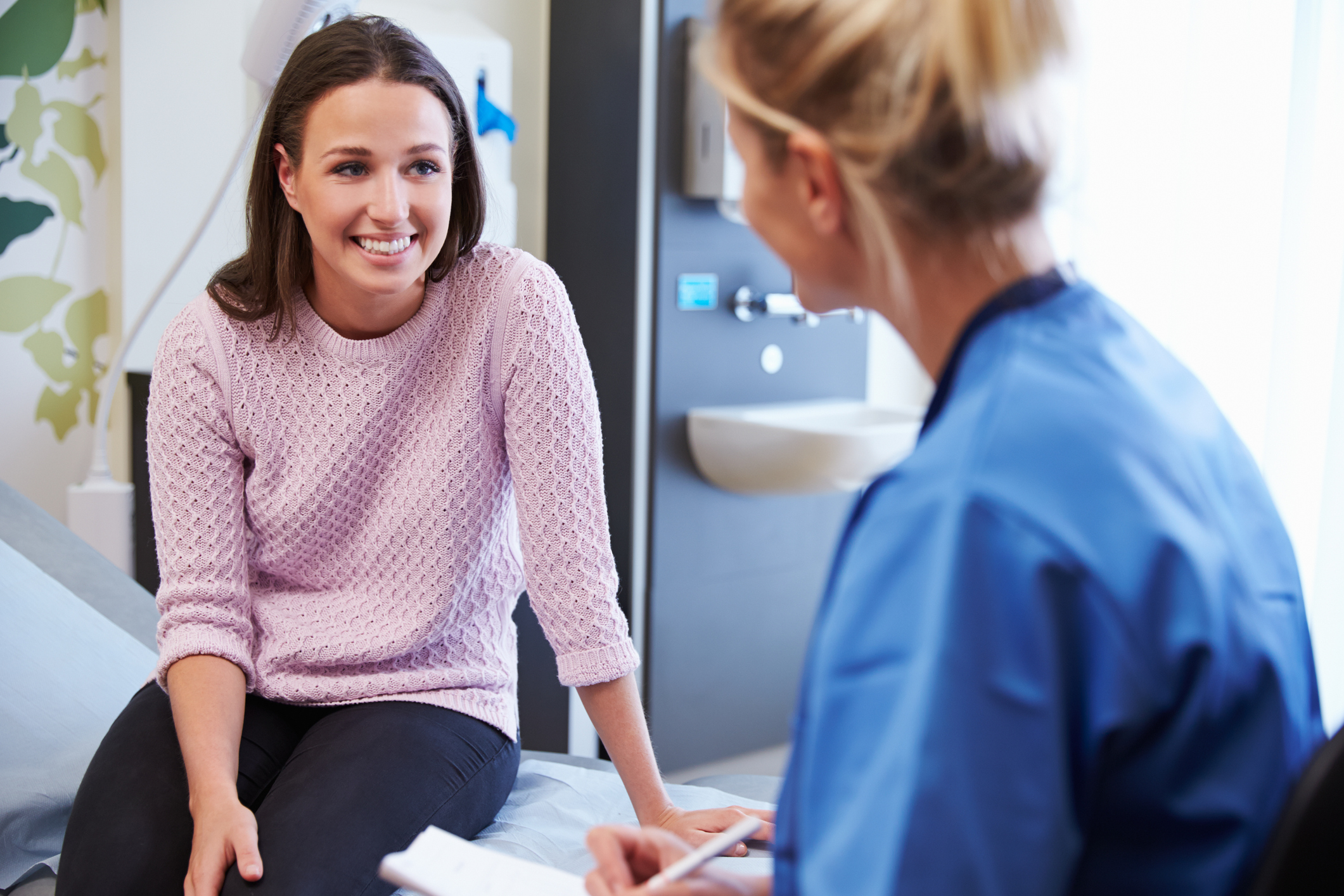 Doctor talking to female patient