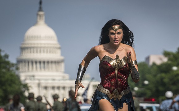 Wonder Woman running in front of the Capitol Building