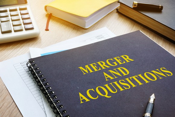 Picture of a notebook with mergers and acquisitions on the cover