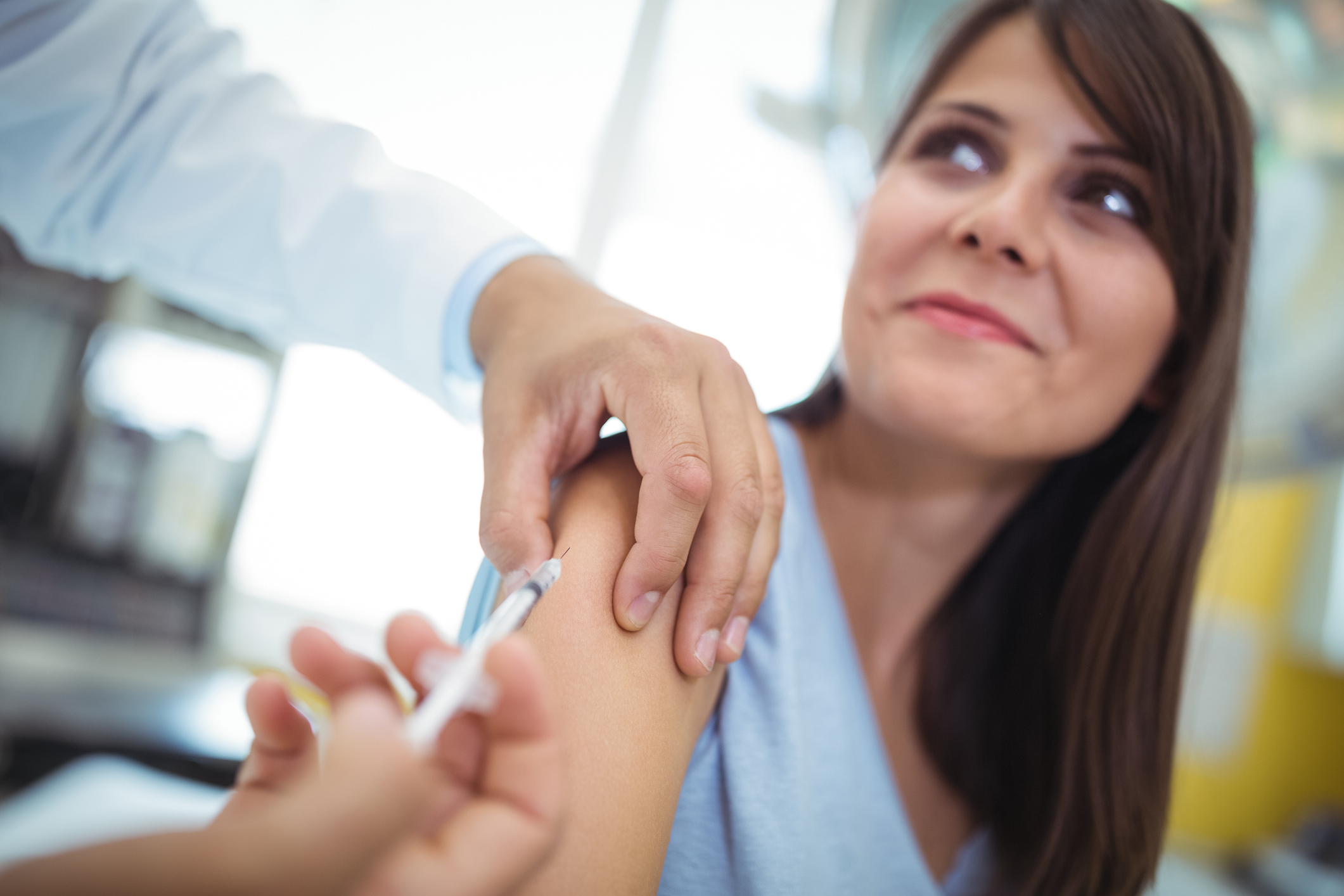 A woman being vaccinated.