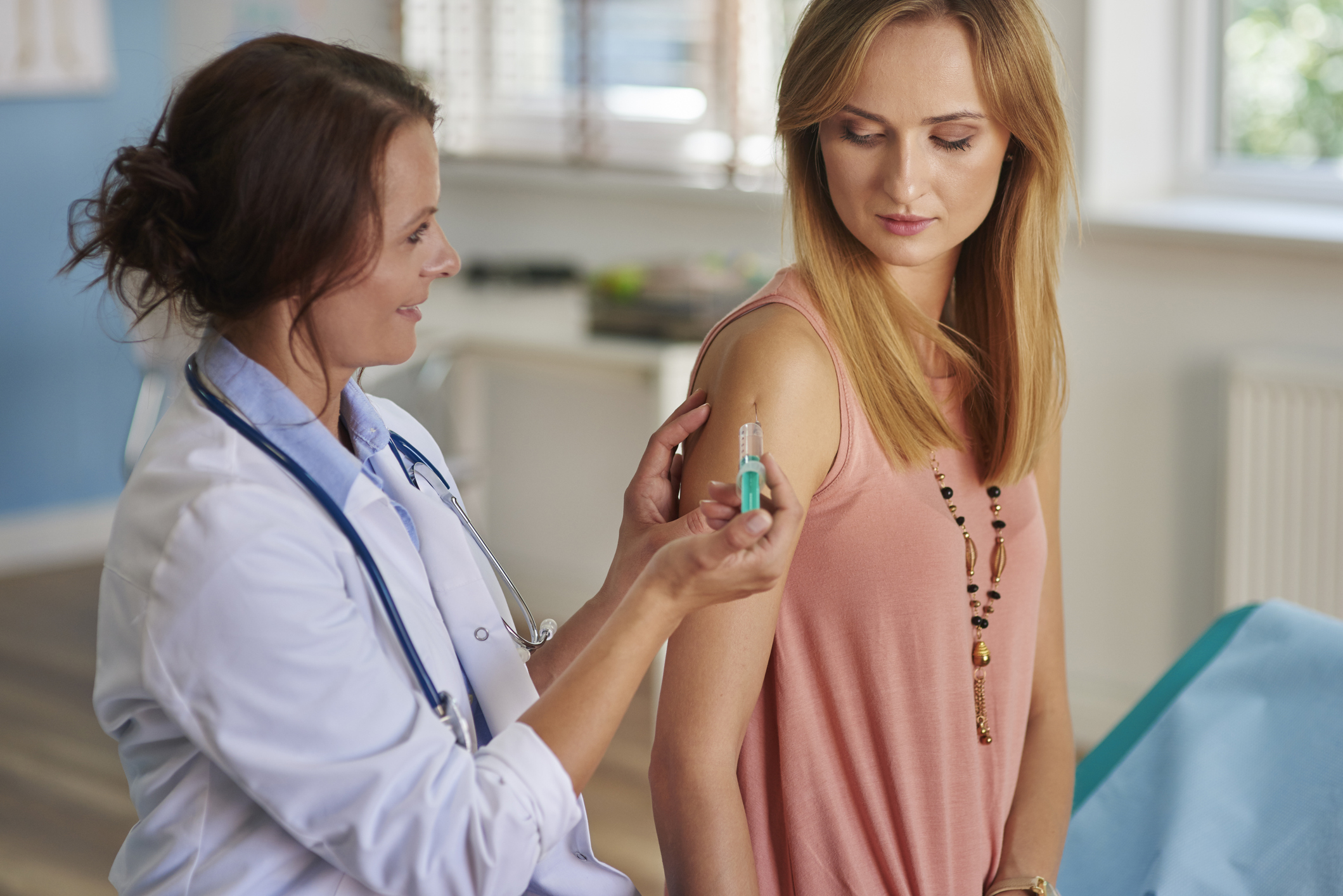 Person receiving a vaccination.