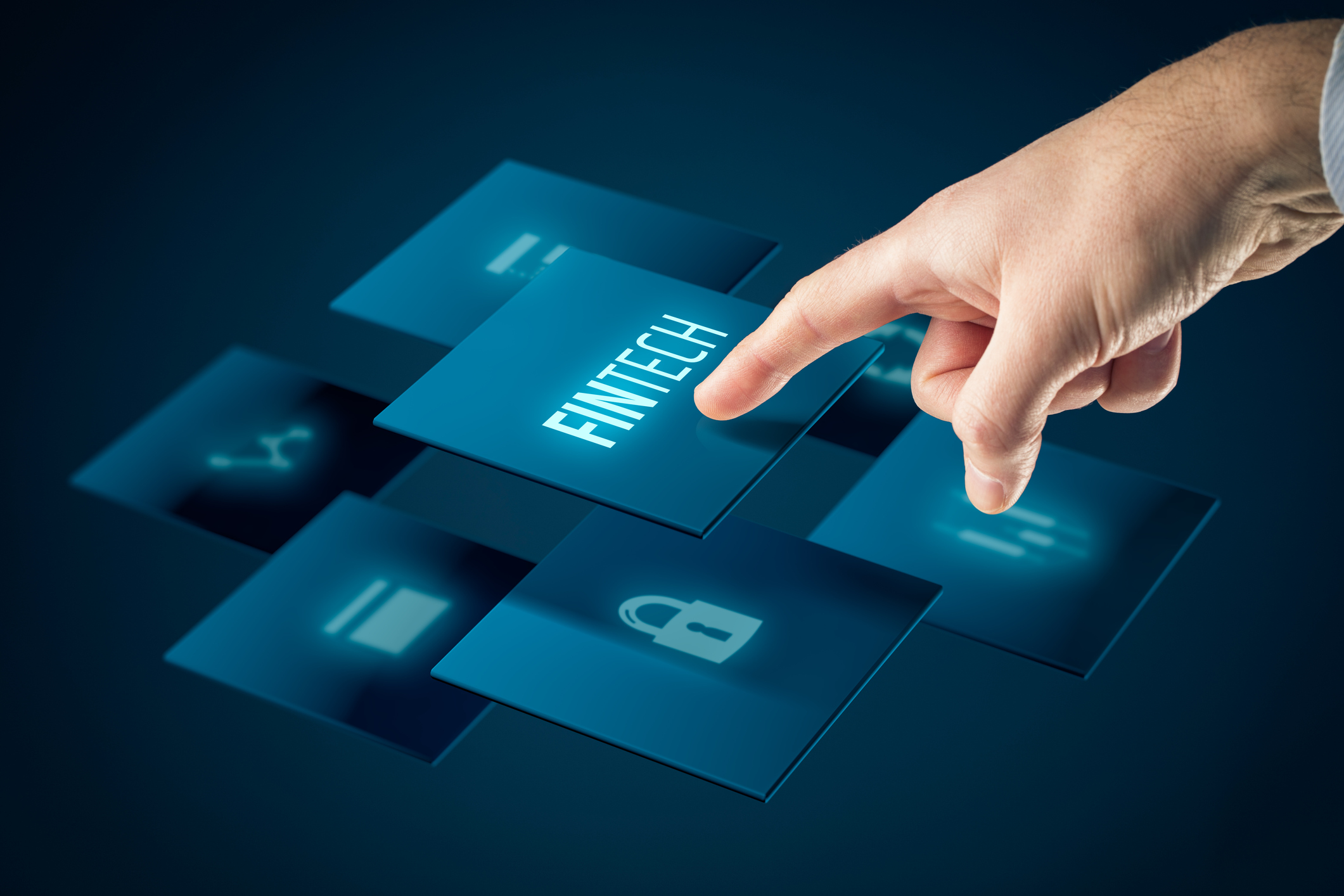 A hand hits an electronic icon that says the word Fintech.