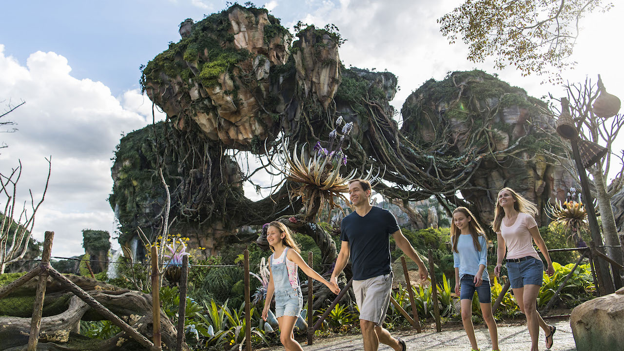 A family walks through Pandora -- The World of Avatar at Disney's Animal Kingdom park.