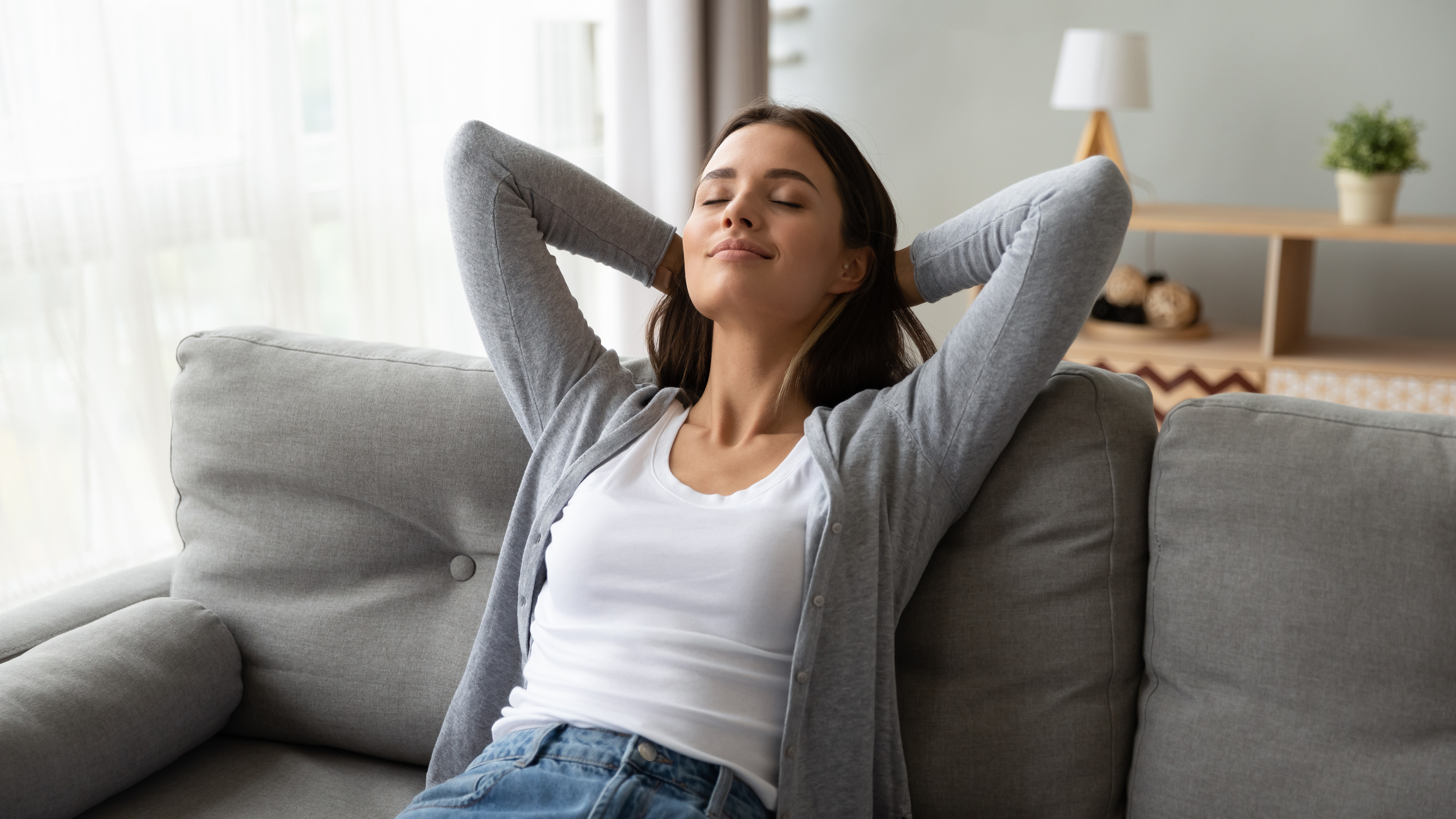 A woman sitting on a couch.