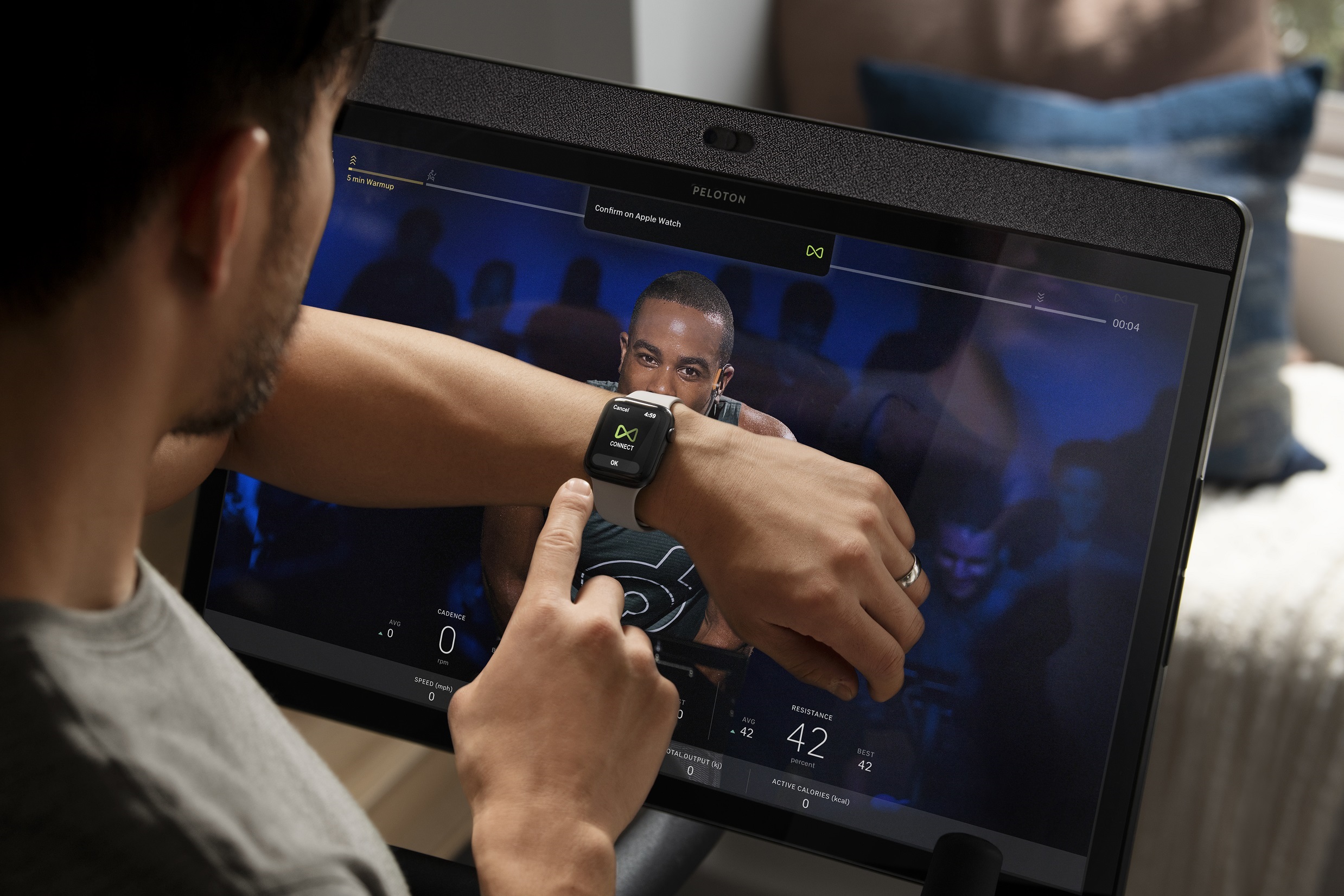 A Peloton customer using the connected fitness feature.