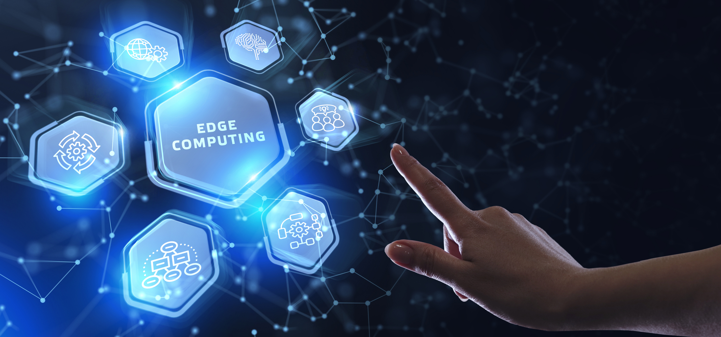 A person touching an icon that says 'edge computing.'