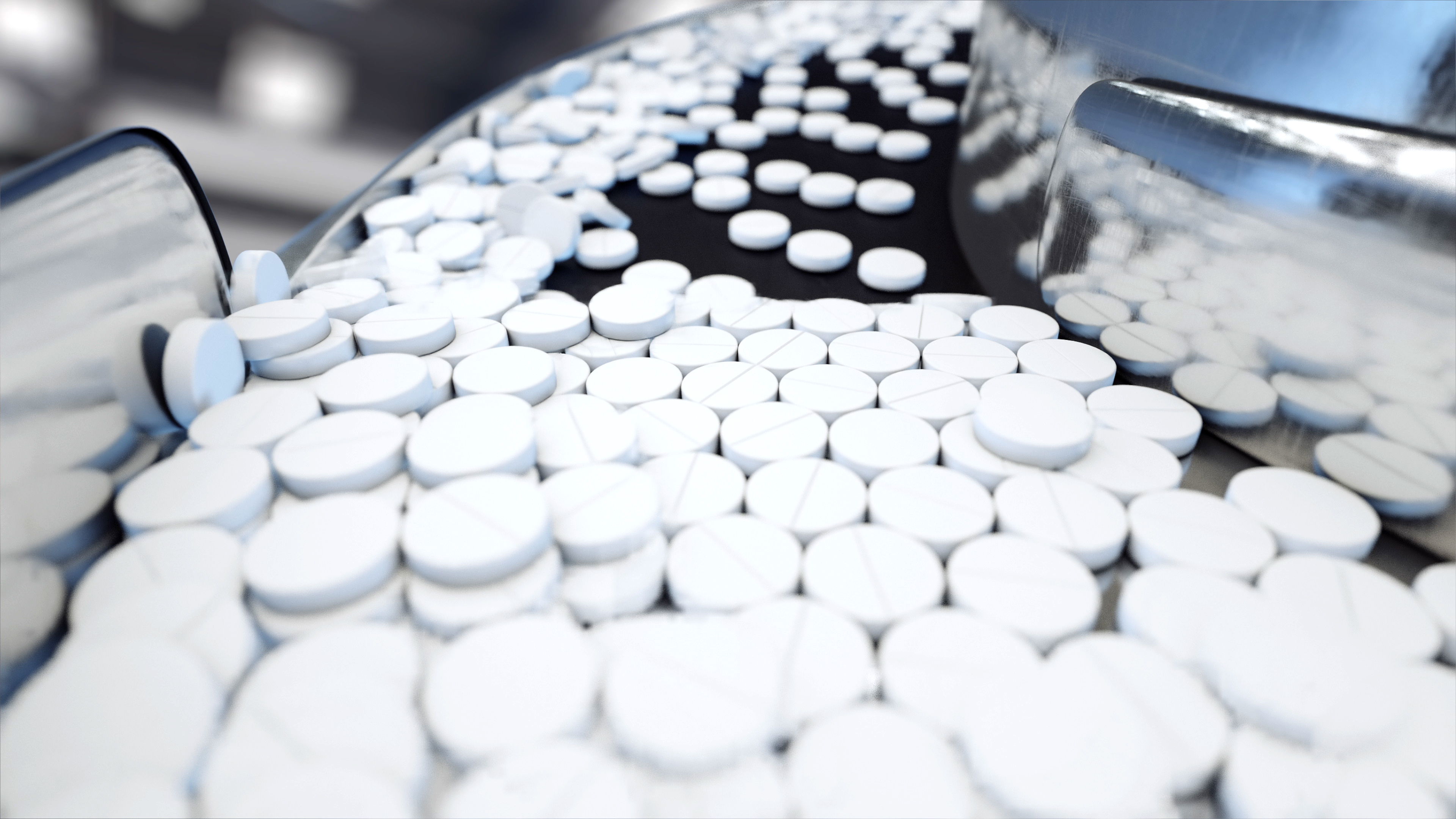 Pills on conveyor in pharmaceutical plant