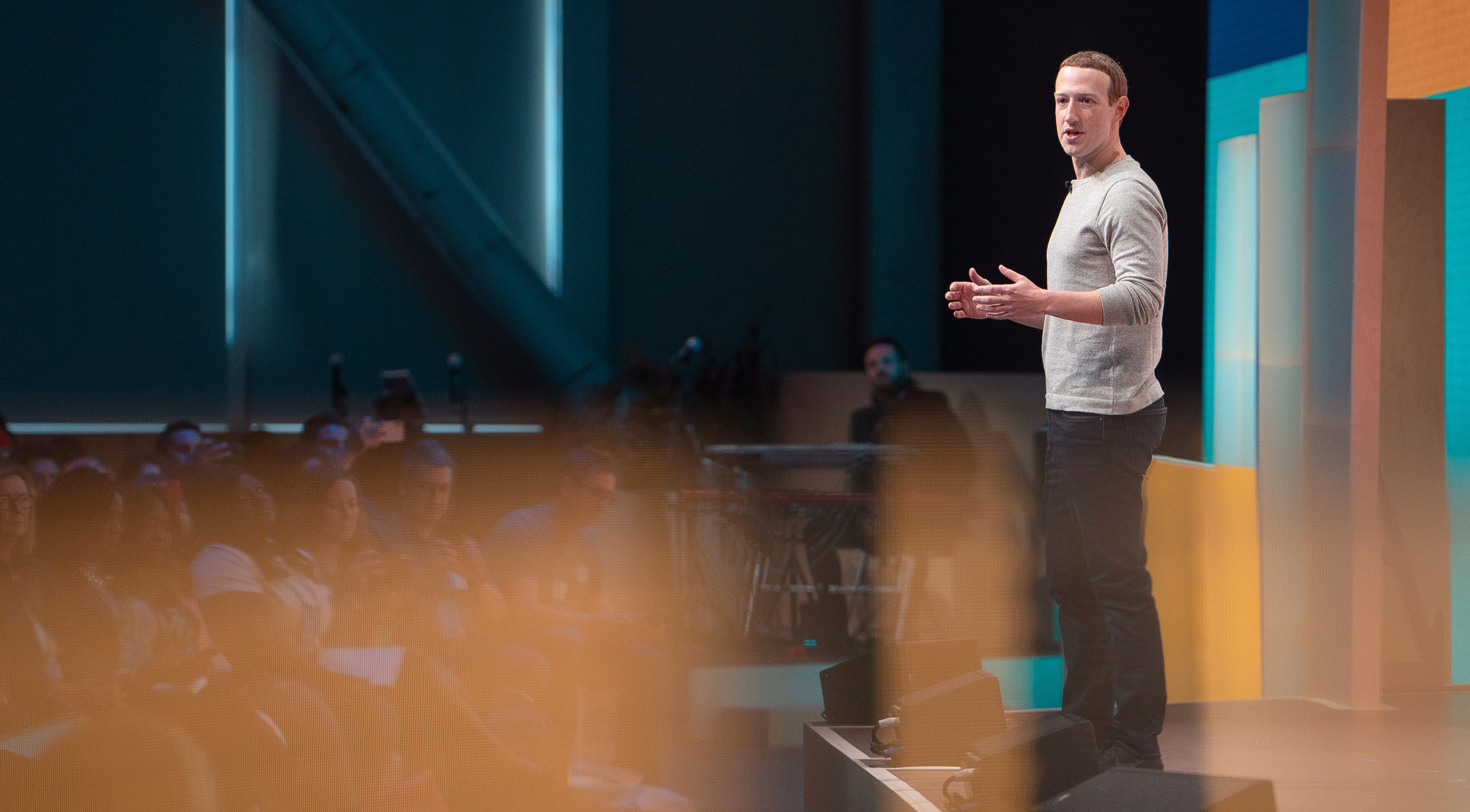 Mark Zuckerberg speaking on a stage in front of an audience