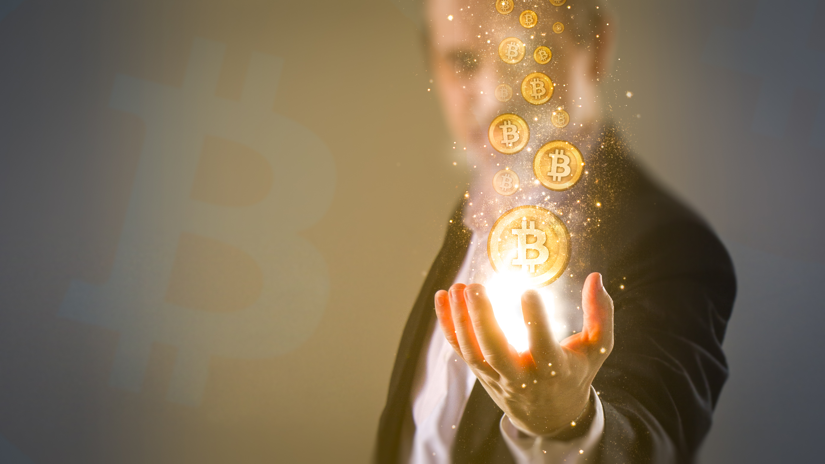 Man with his hand outstretched and illustrations of bitcoin tokens hovering above it