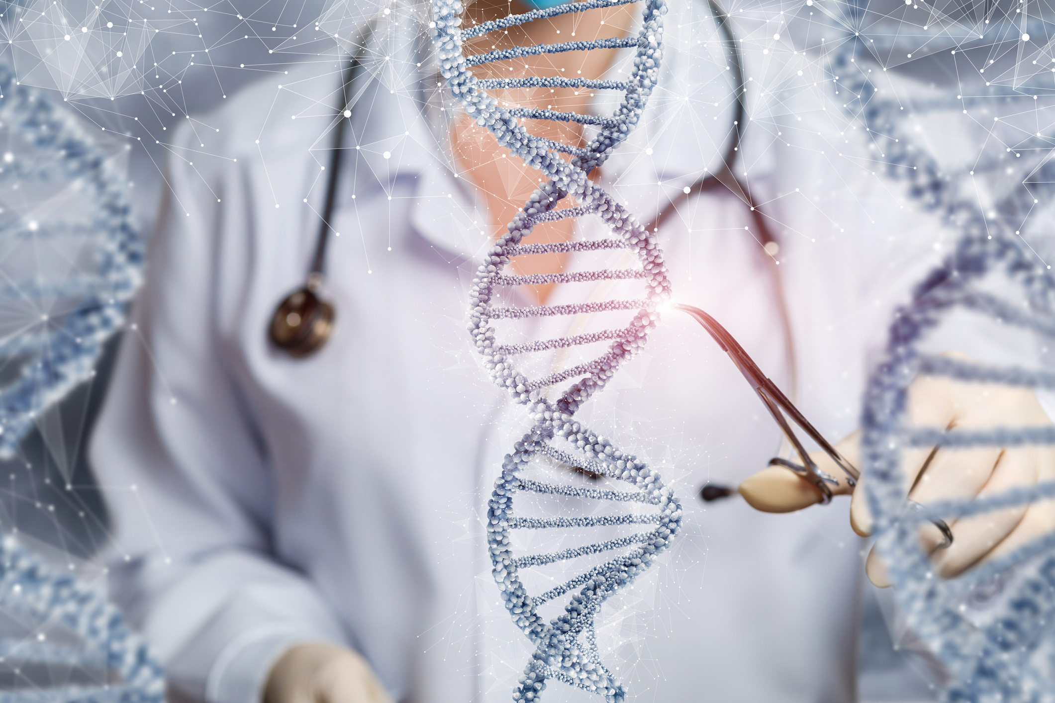 A doctor using small scissors to cut out a portion of the double helix DNA strand.
