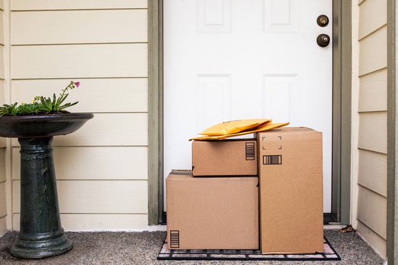 Several packages outside the front door of a home