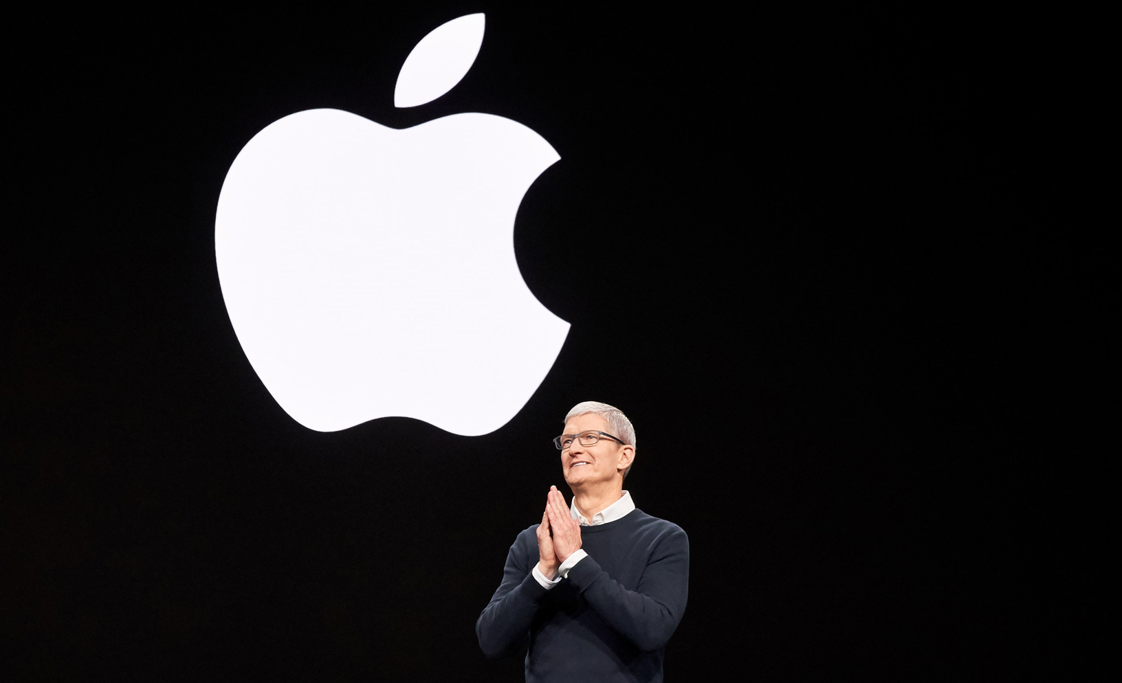 CEO Tim Cook in front of the Apple logo