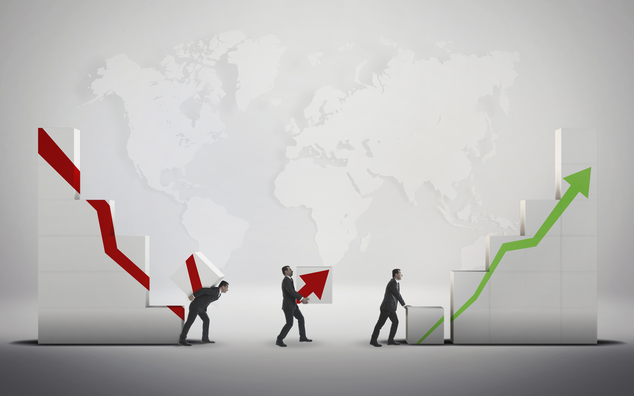 red arrow trending downward carried by men and suits with another man pushing green arrow upward against background of world map