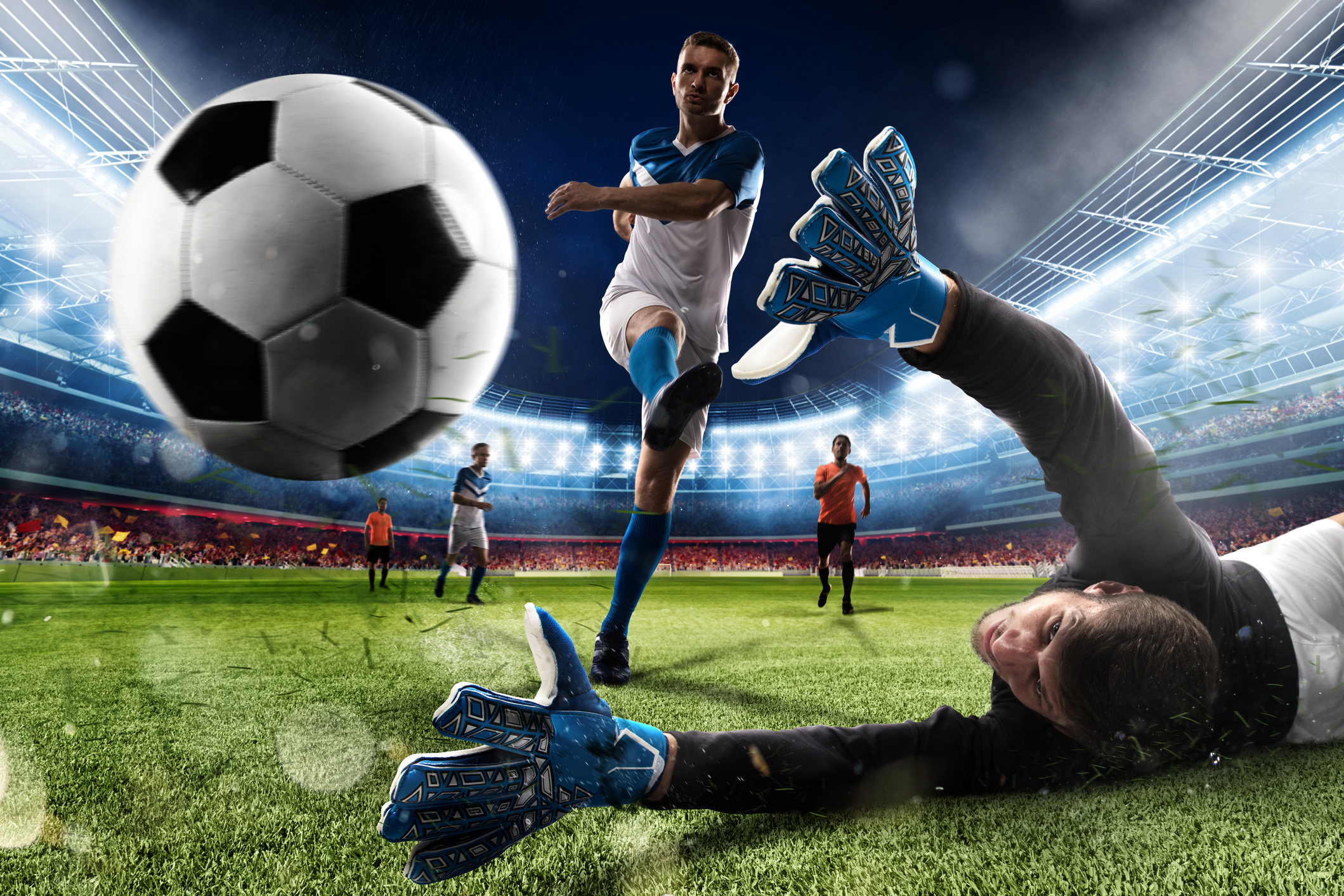 A soccer player scoring a goal.