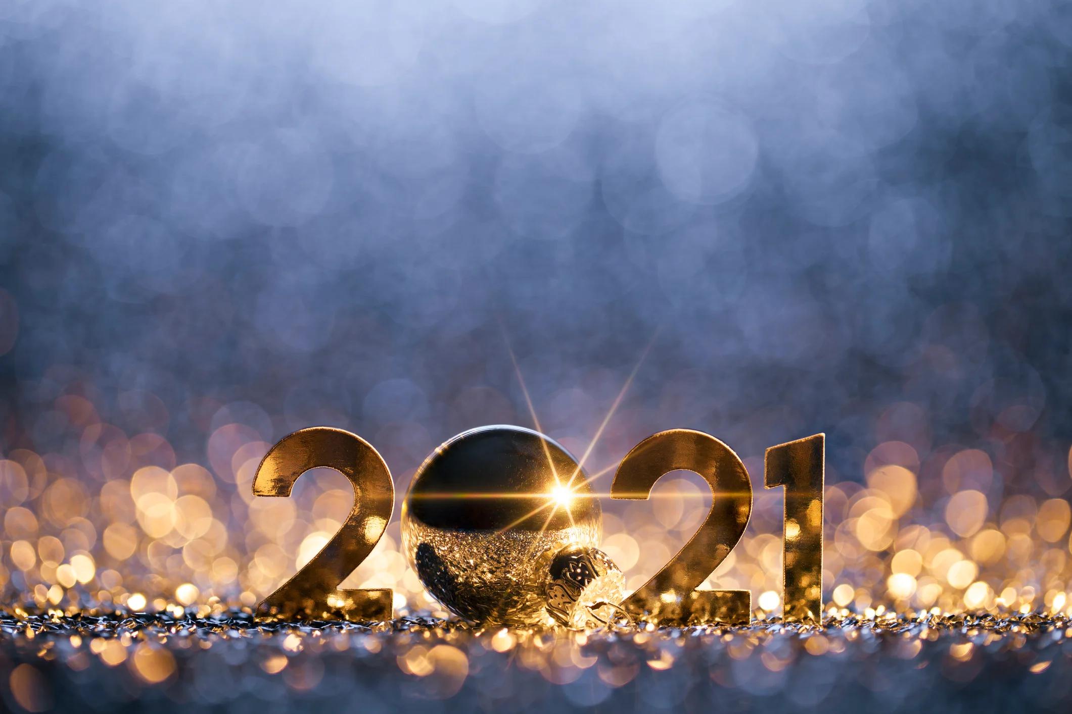 Gold 2021 with glowing sparkles around.