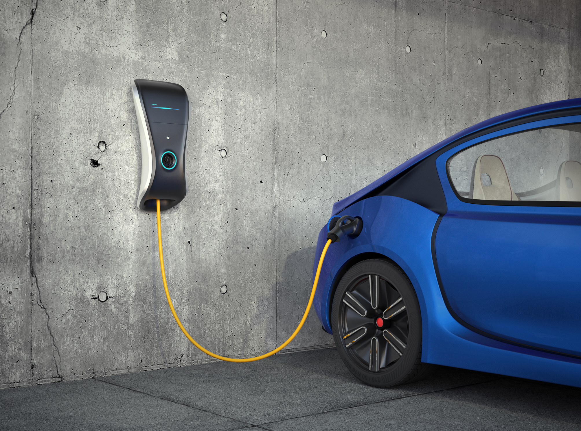 Electric vehicle getting a charge in a garage.