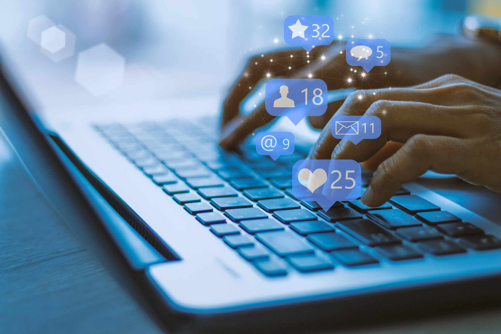A laptop user accesses a social network on a laptop.