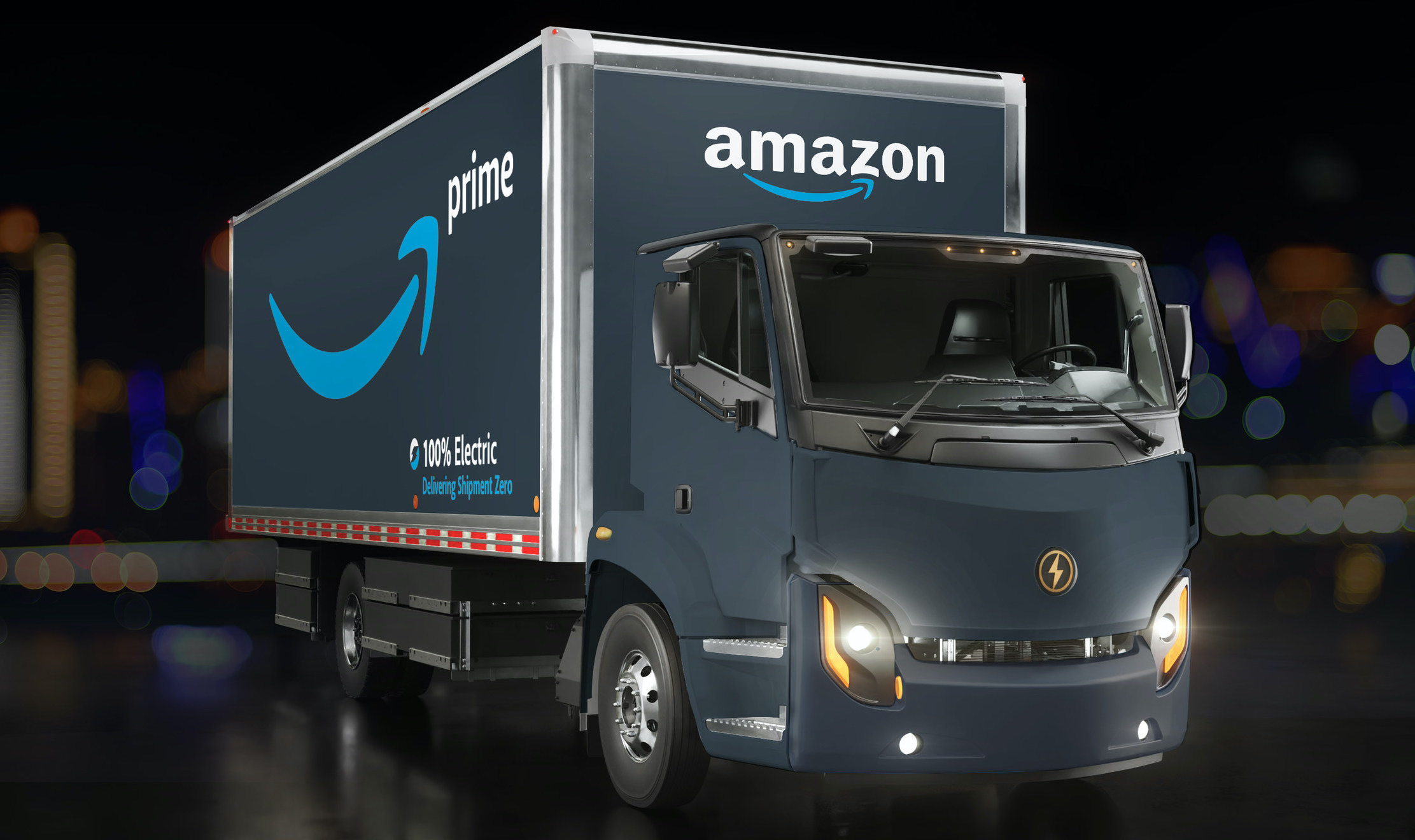 A Lion Electric box truck with Amazon logos.