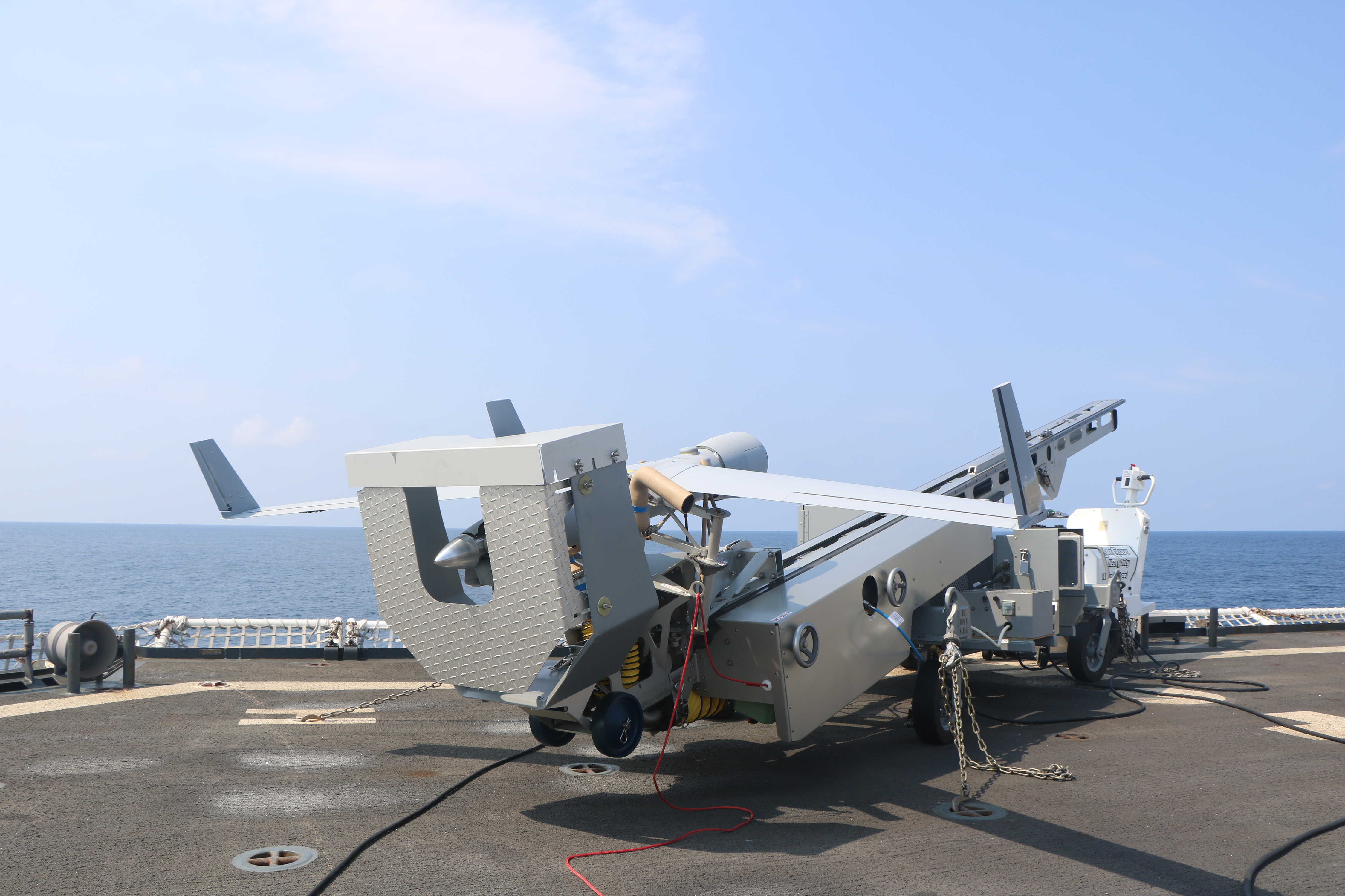 A ScanEagle drone on a launch pad.