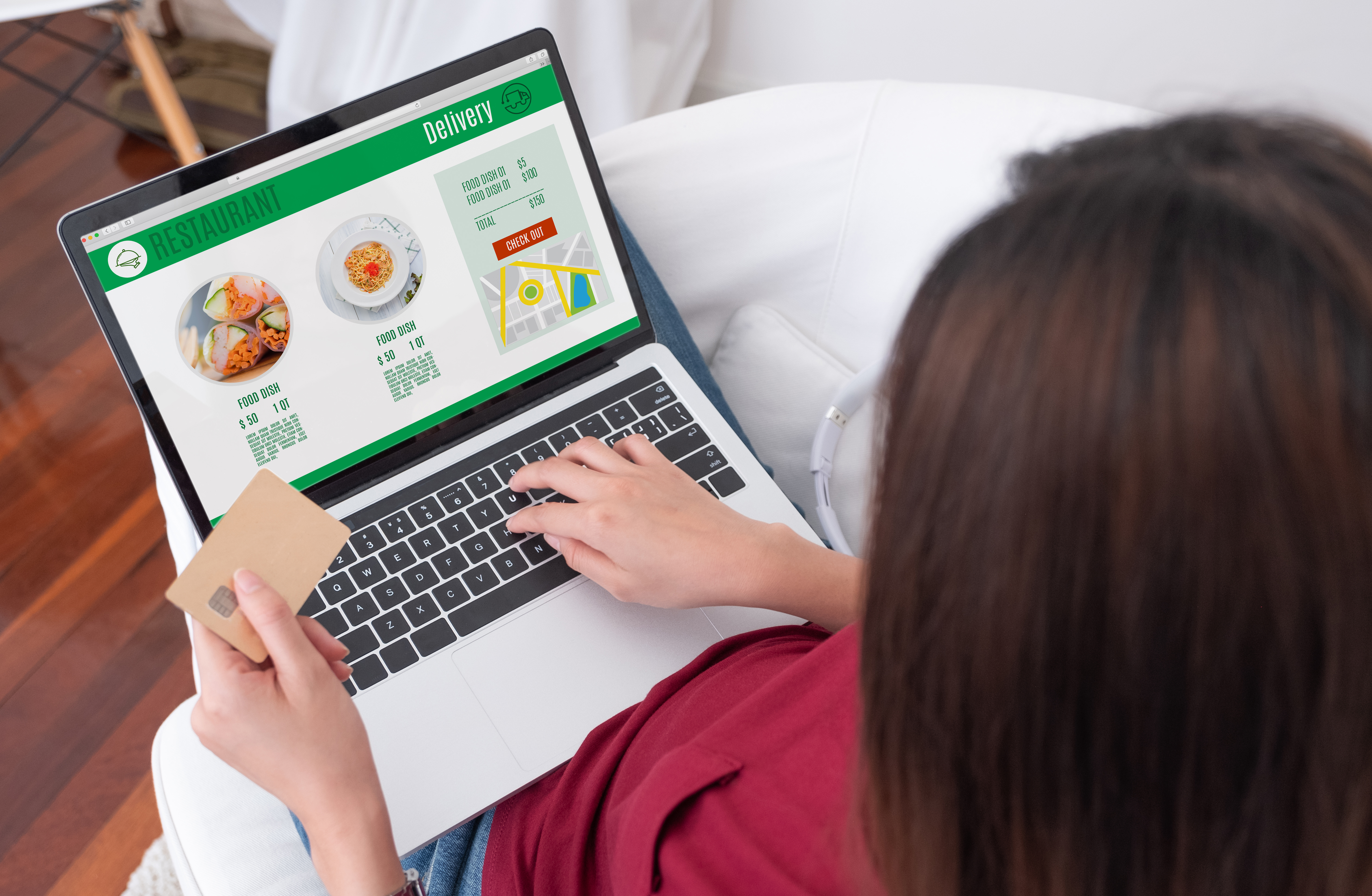Woman shopping on laptop with credit card