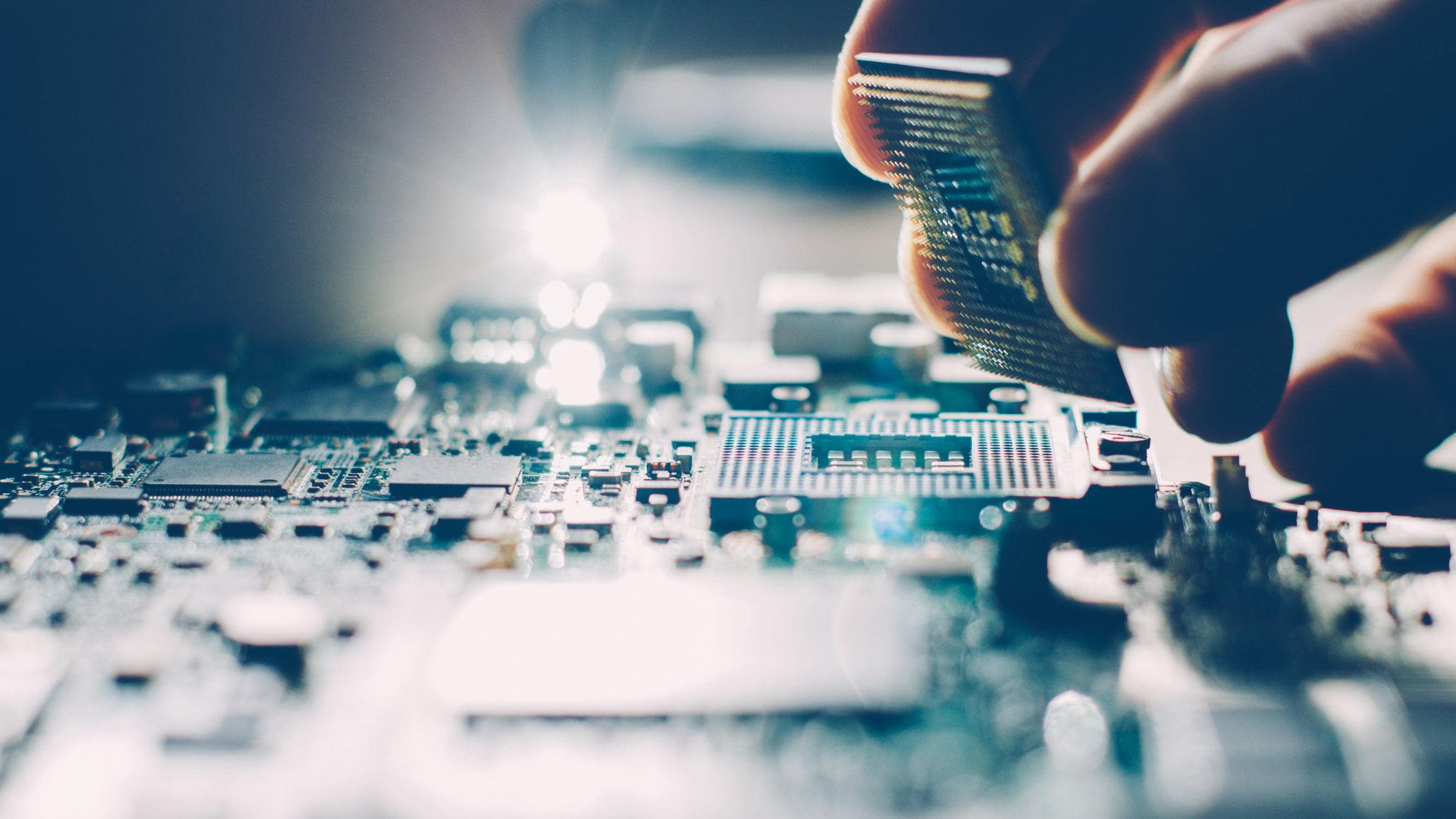 CPU being inserted by a hand.