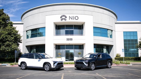 Two NIO ES8 electric SUVs parked in front of the company's California office. 