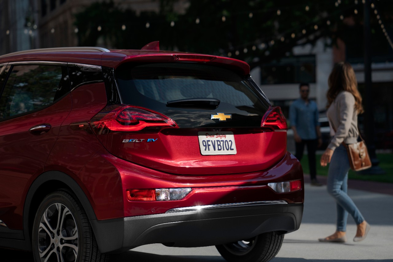 A Chevy Bolt on a city street