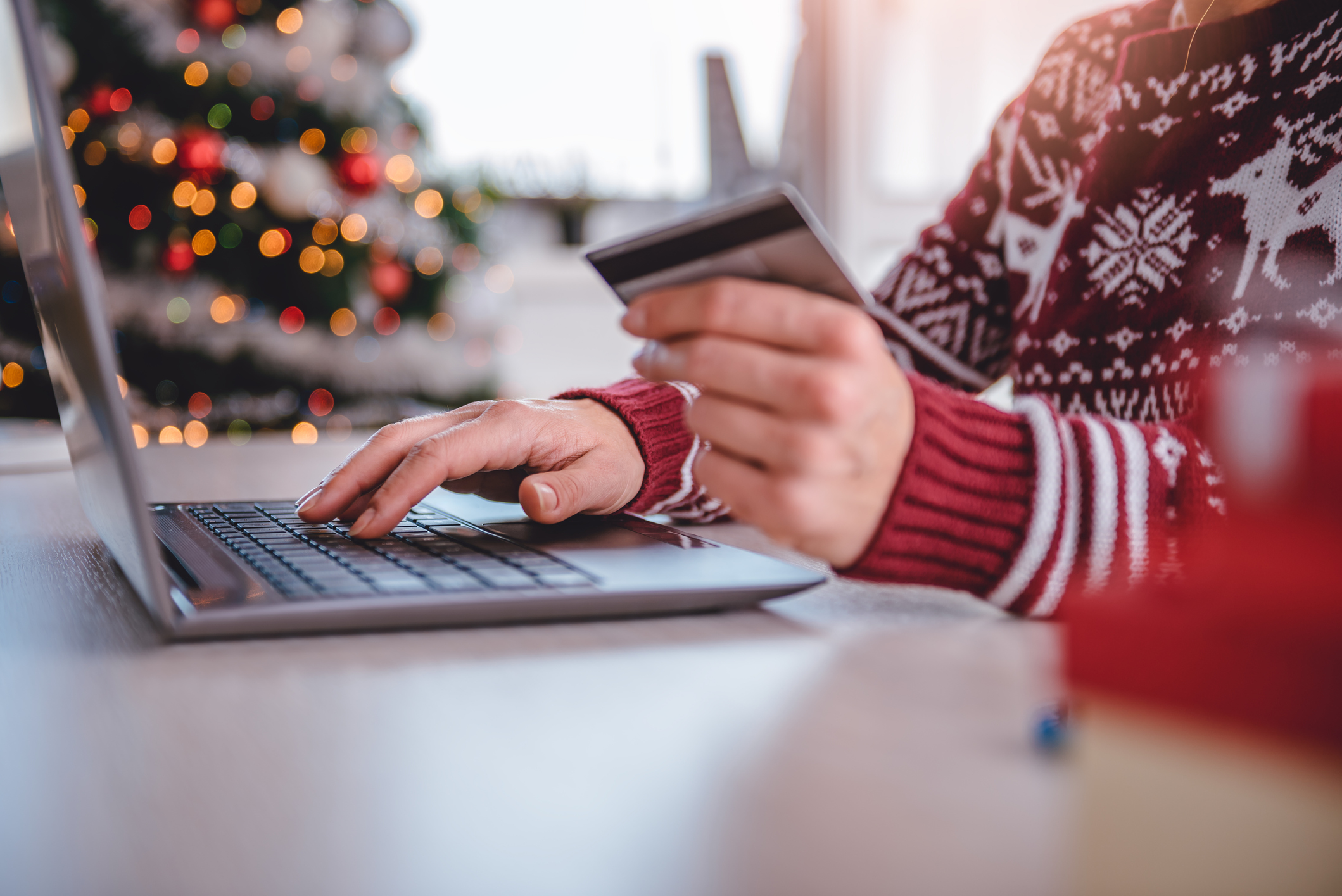 A shopper uses a credit card online.