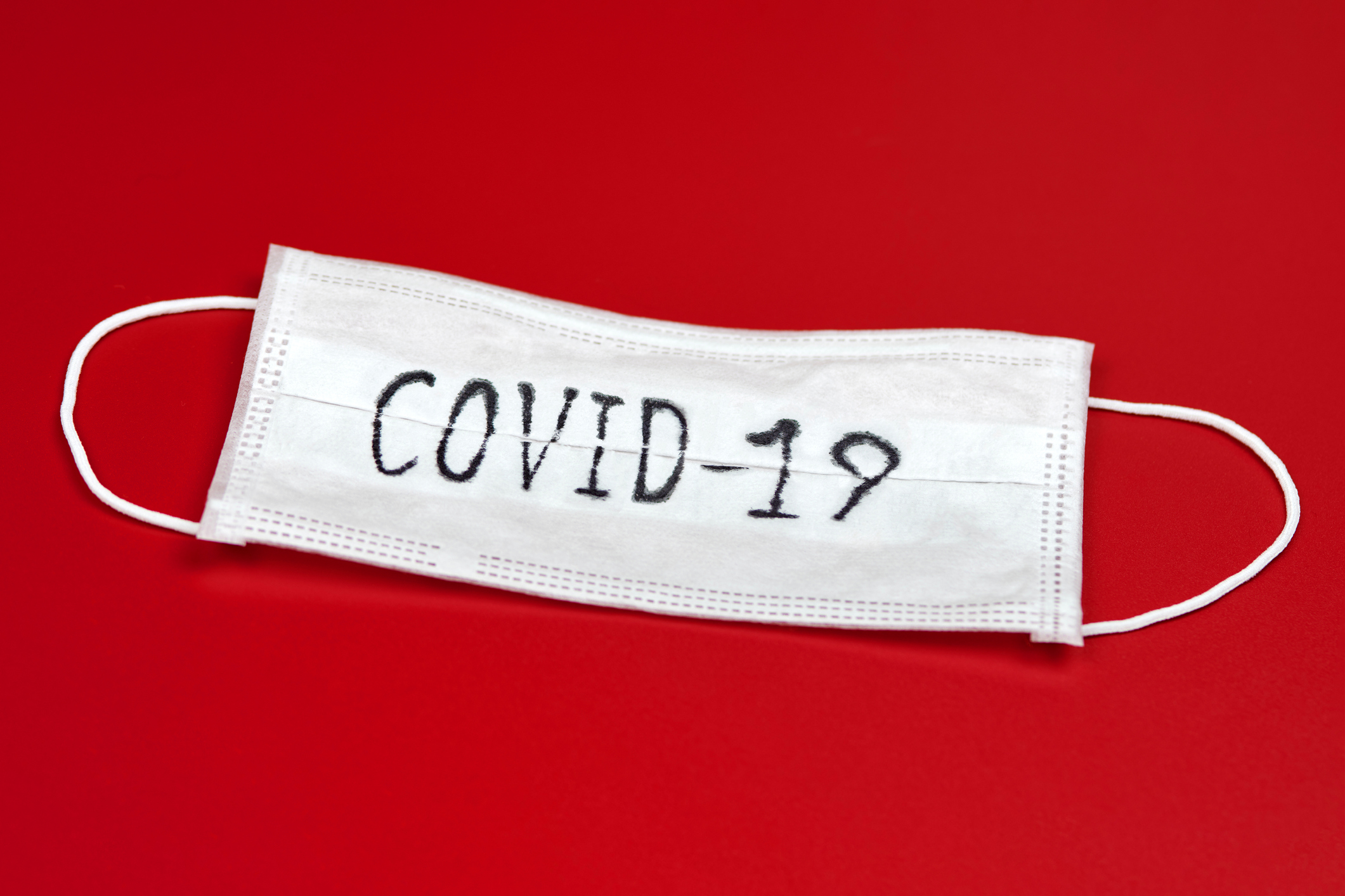 Face mask with "COVID-19" written on it.