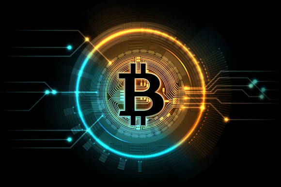 A digital circle around the symbol for bitcoin.