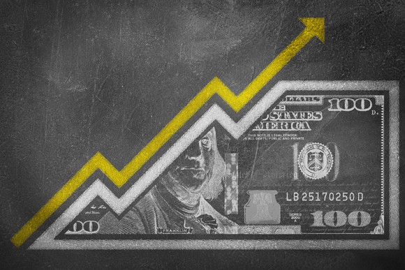 Chalk drawing of a dollar bill with a rising arrow to represent inflation.