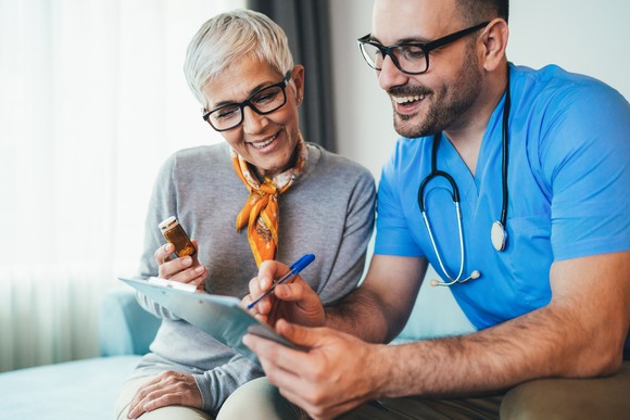A doctor consults with a patient.