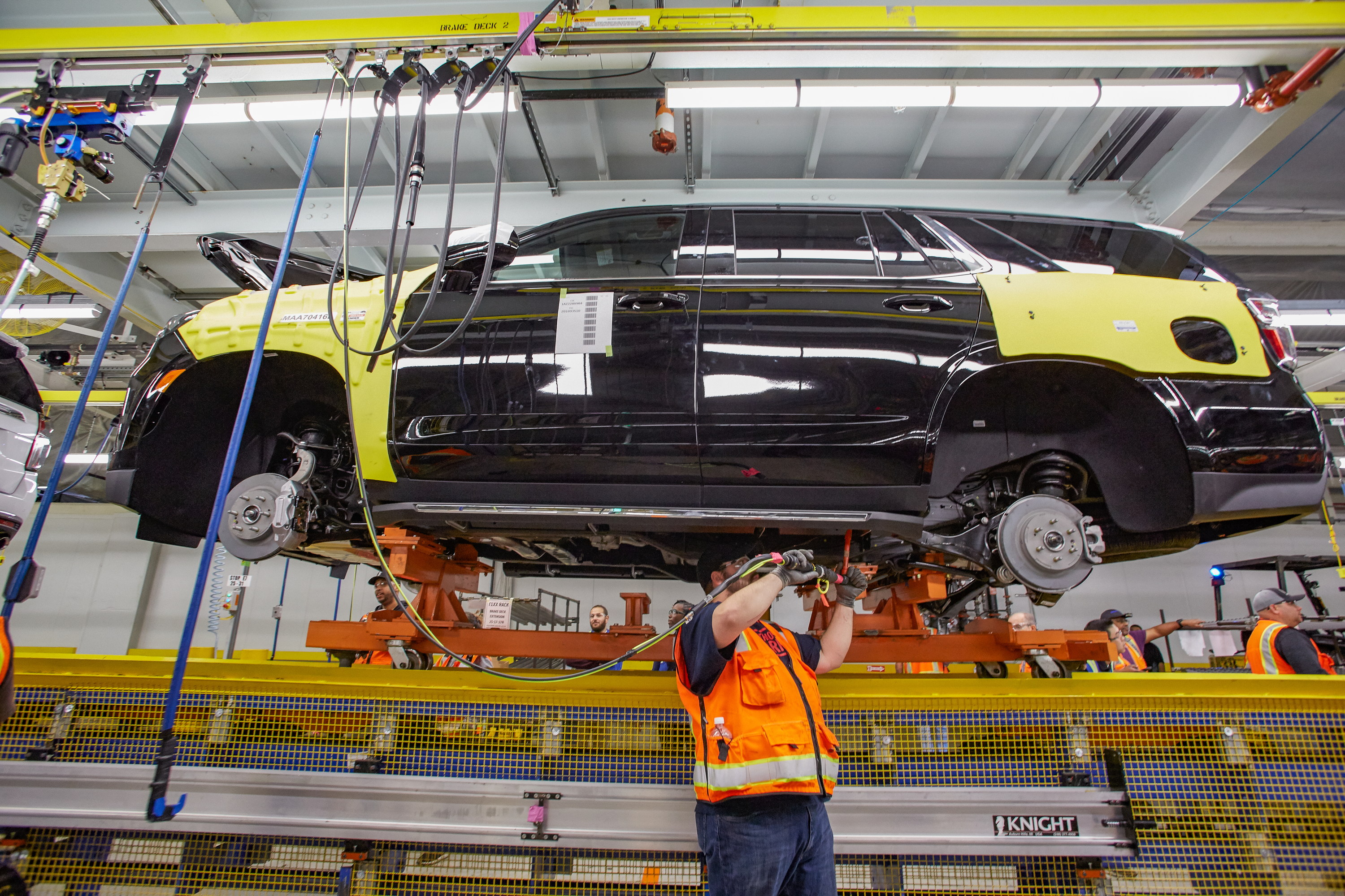 A worker tends to a 2021 Chevrolet Suburban on the assembly line at GM's plant in Arlington, Texas.