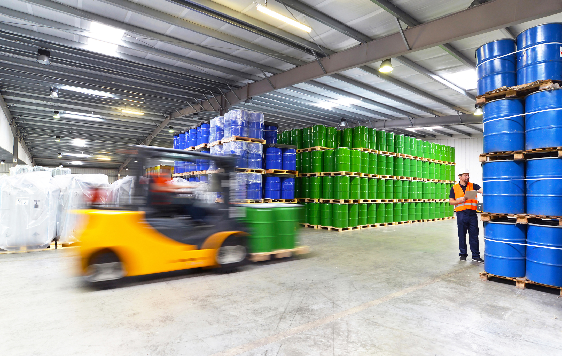 Someone driving forklift in warehouse