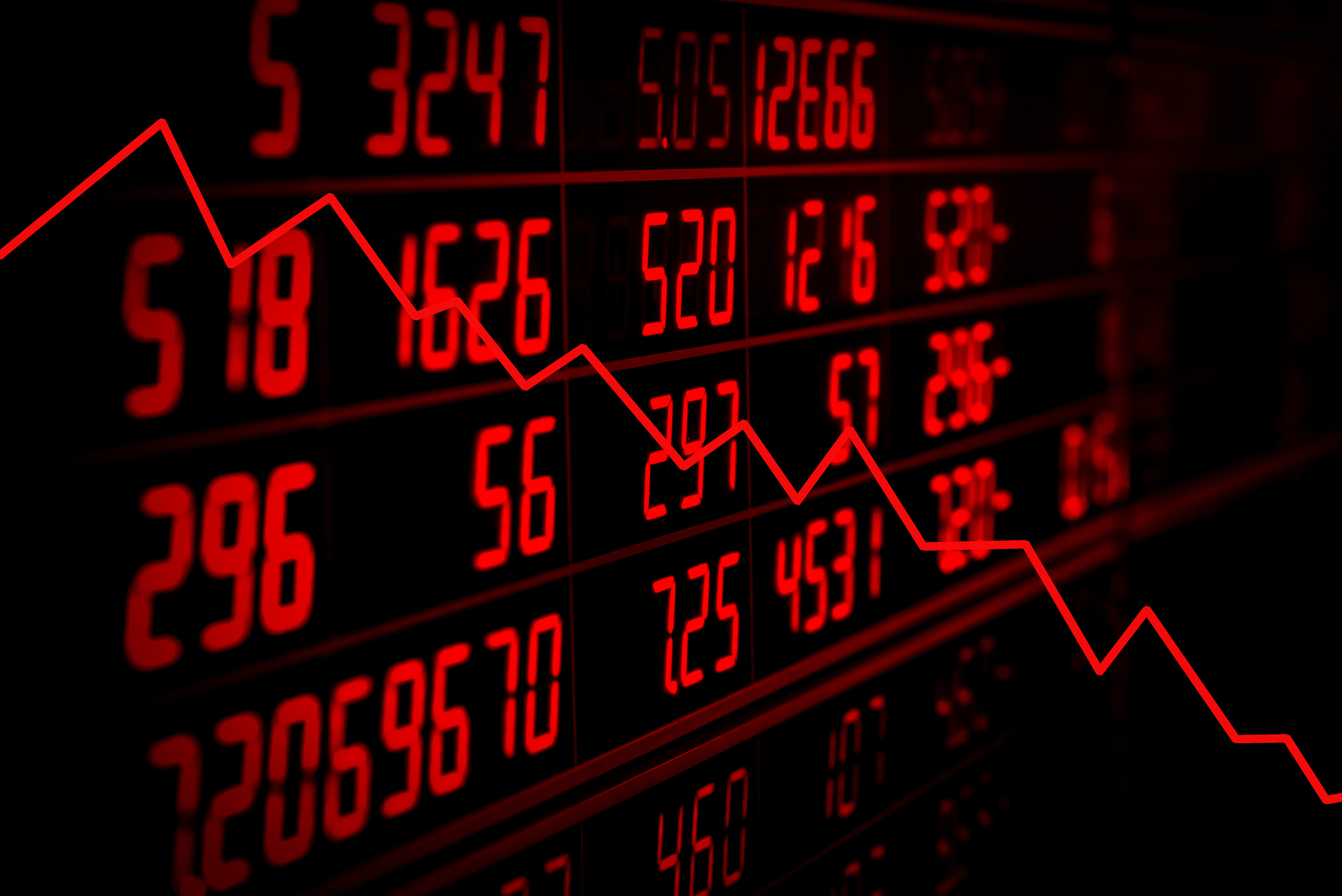 Red stock chart going down with red numbers in the background
