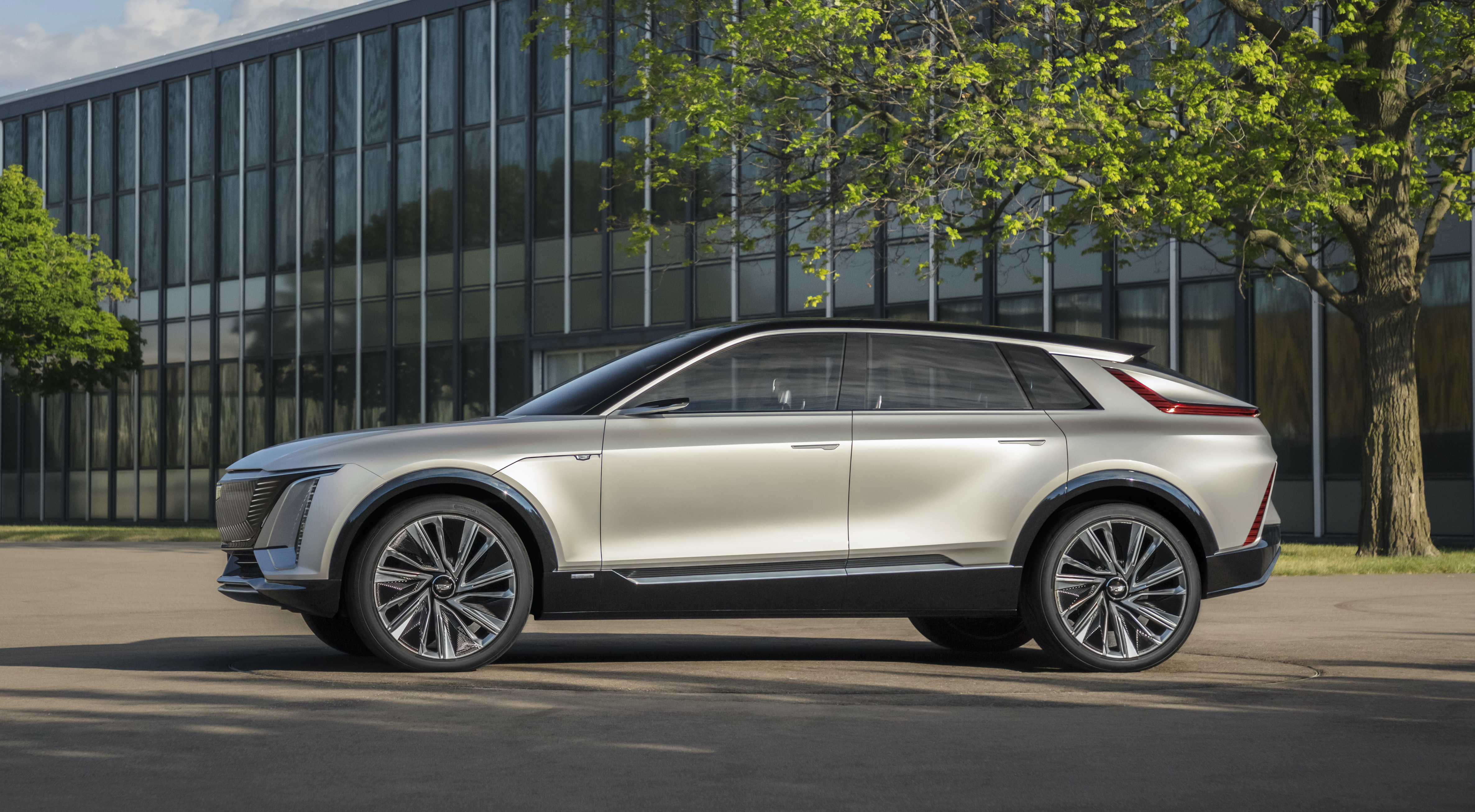 A silver Cadillac Lyriq, a sharply-styled electric luxury SUV.