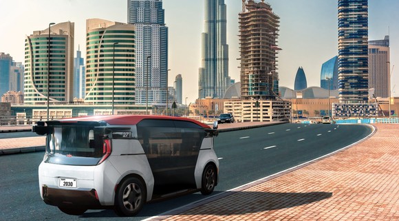 A Cruise Origin self-driving taxi van, shown on a highway entering Dubai. 