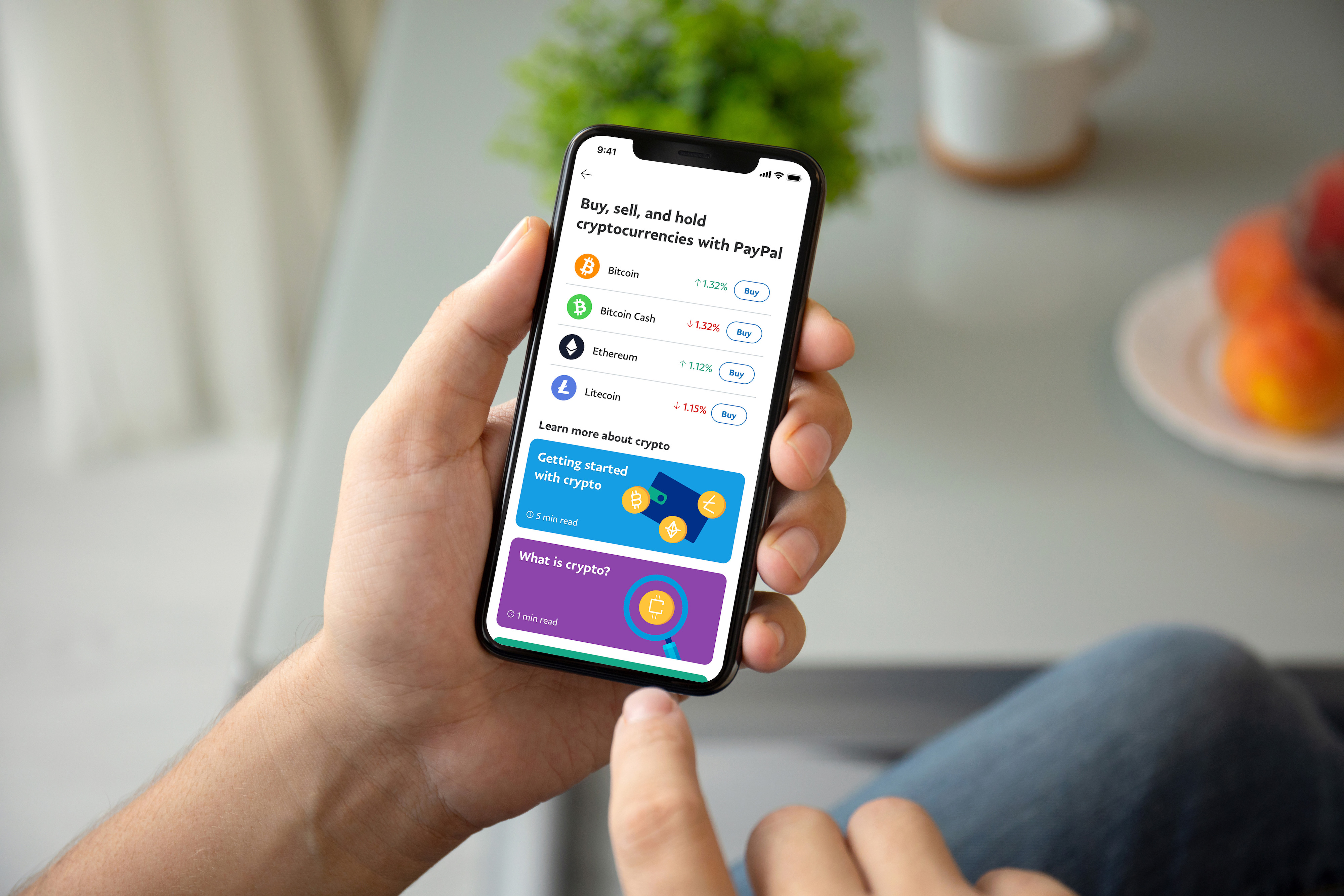 Person viewing cryptocurrency option in PayPal mobile app.