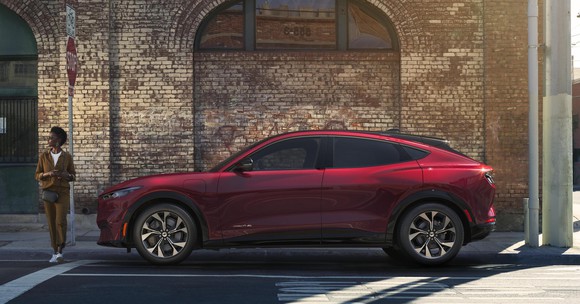 A red Ford Mustang Mach-E, an electric sports SUV.
