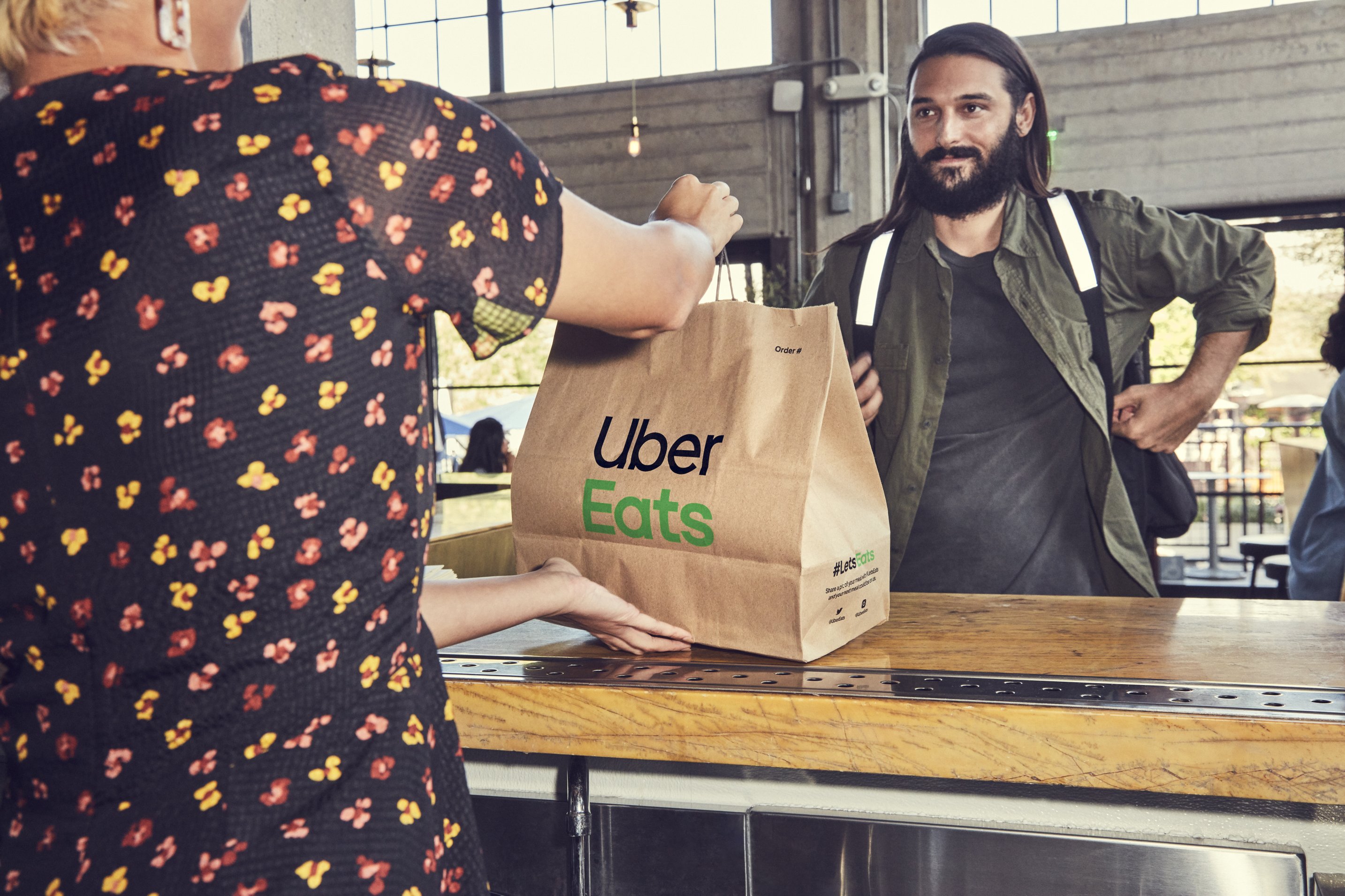 An Uber Eats driver picks up an order.