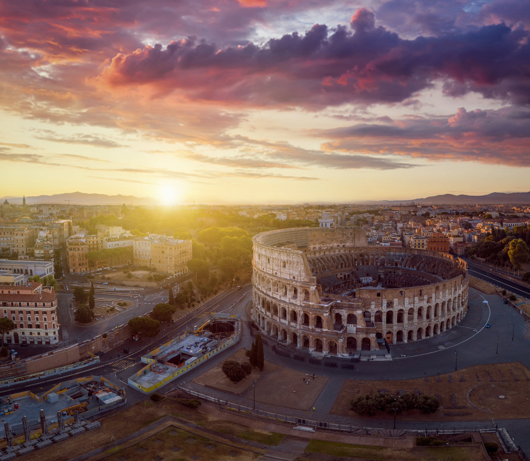 A sun sets over Rome.