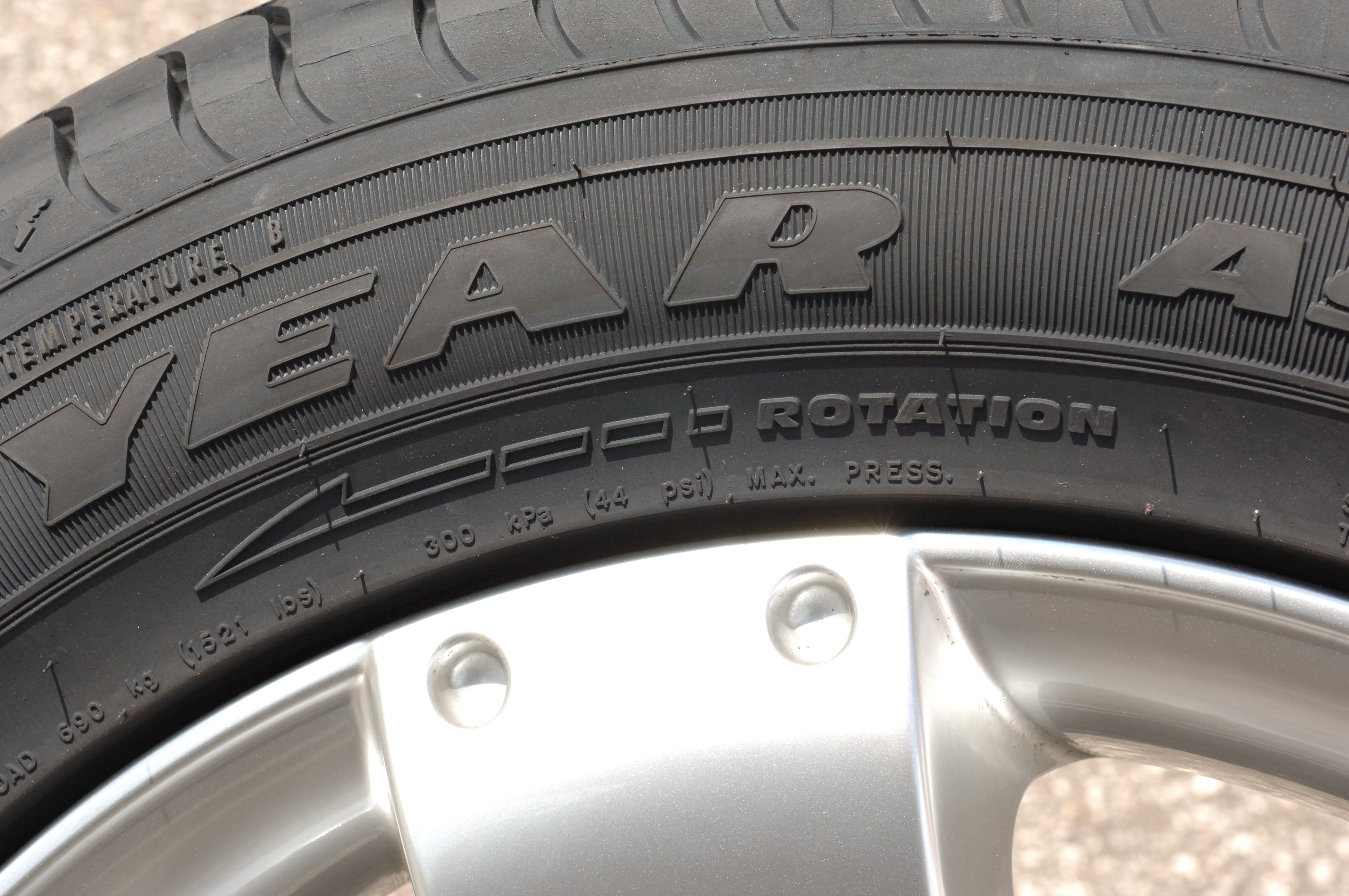 A close-up of a Goodyear tire, with inflation specifications on the sidewall.