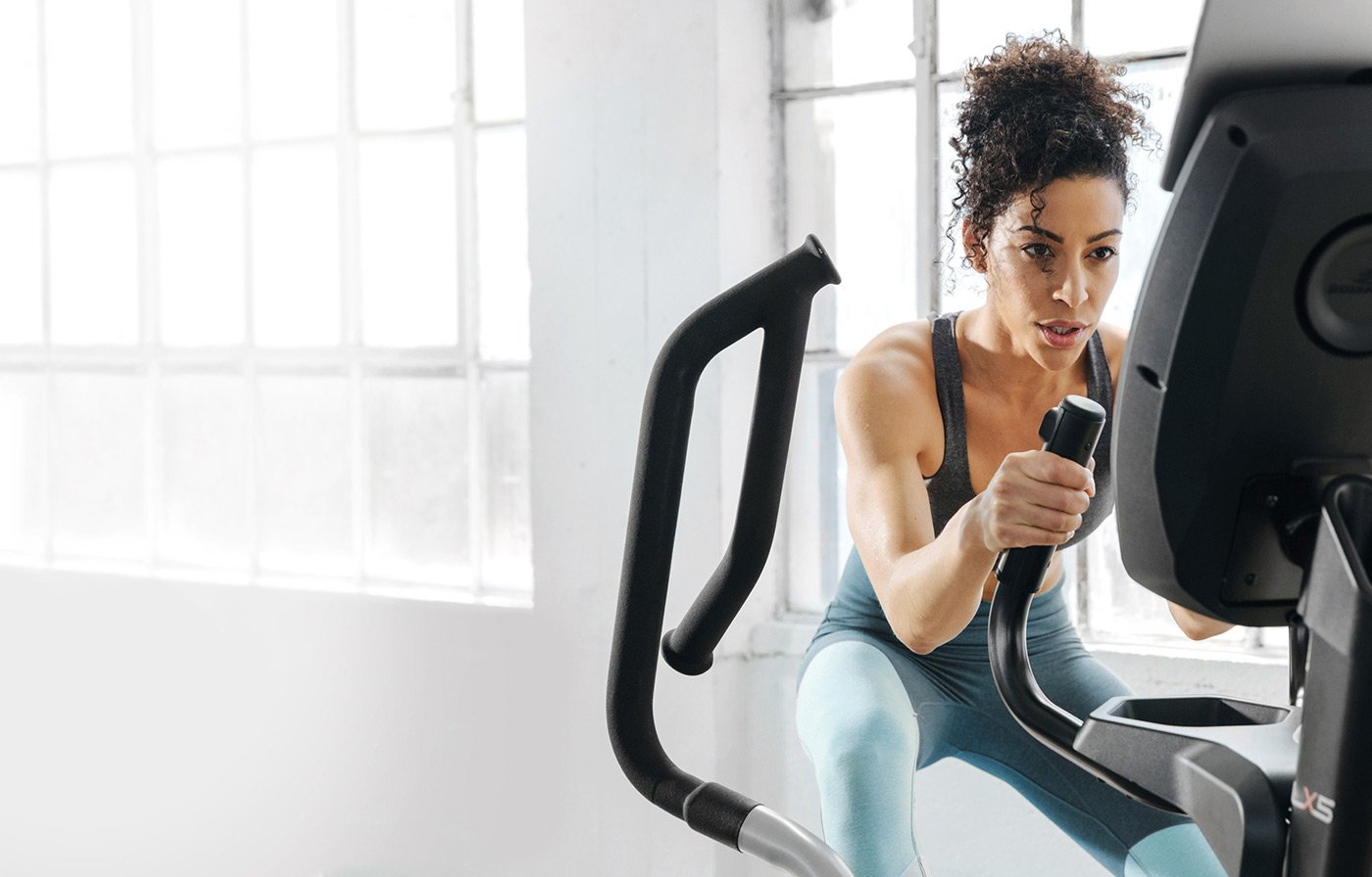 Woman on a piece of exercise equipment