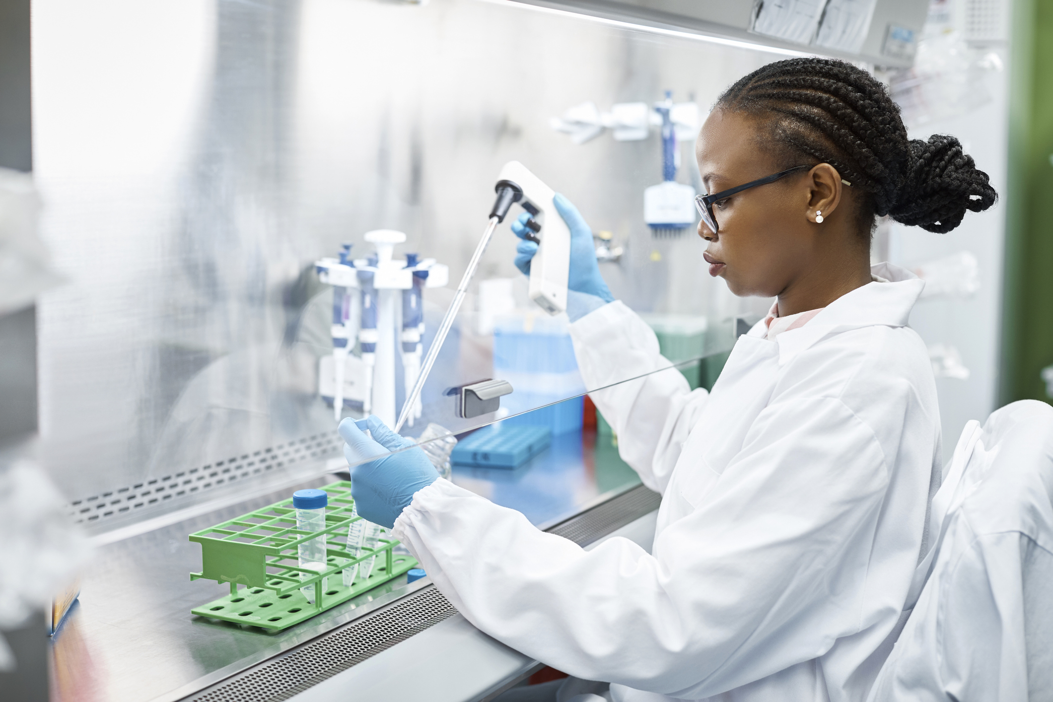 Researcher filling vials in lab
